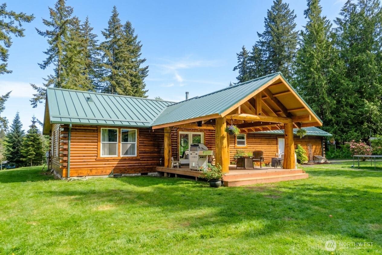 134 Bishop Road Port Angeles, WA 98363 - Photo 2 of 38 a front view of a house with a yard