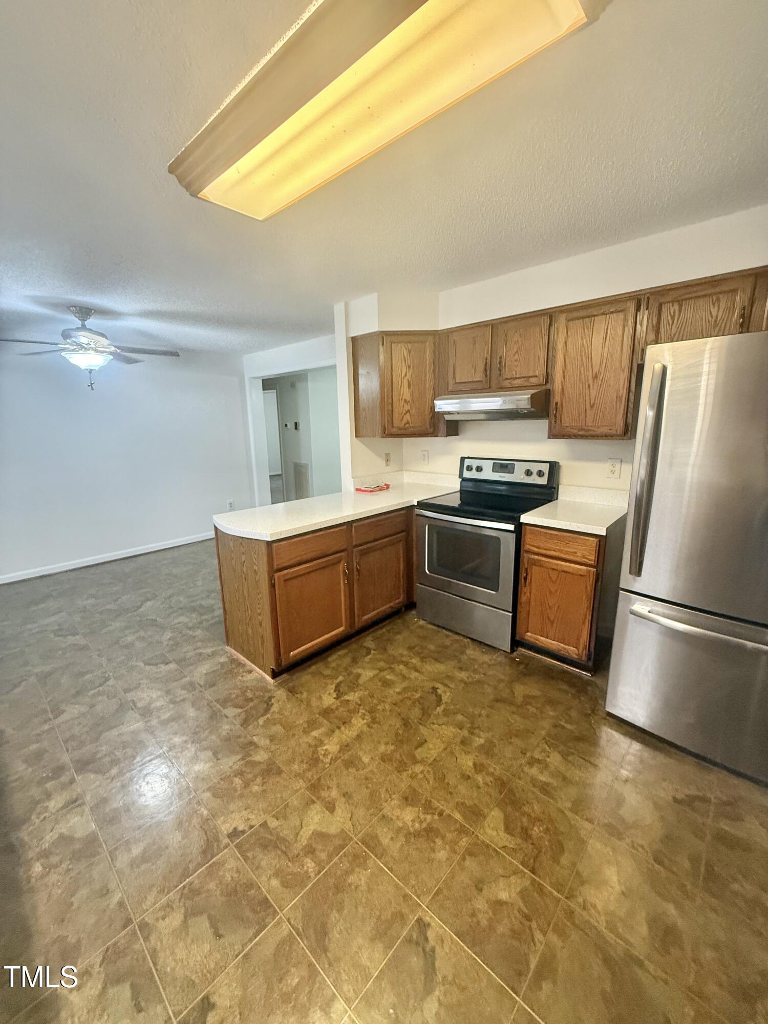 192 Misty Hollow Road Timberlake, NC 27583 - Photo 11 of 43 a kitchen with a refrigerator sink and stove