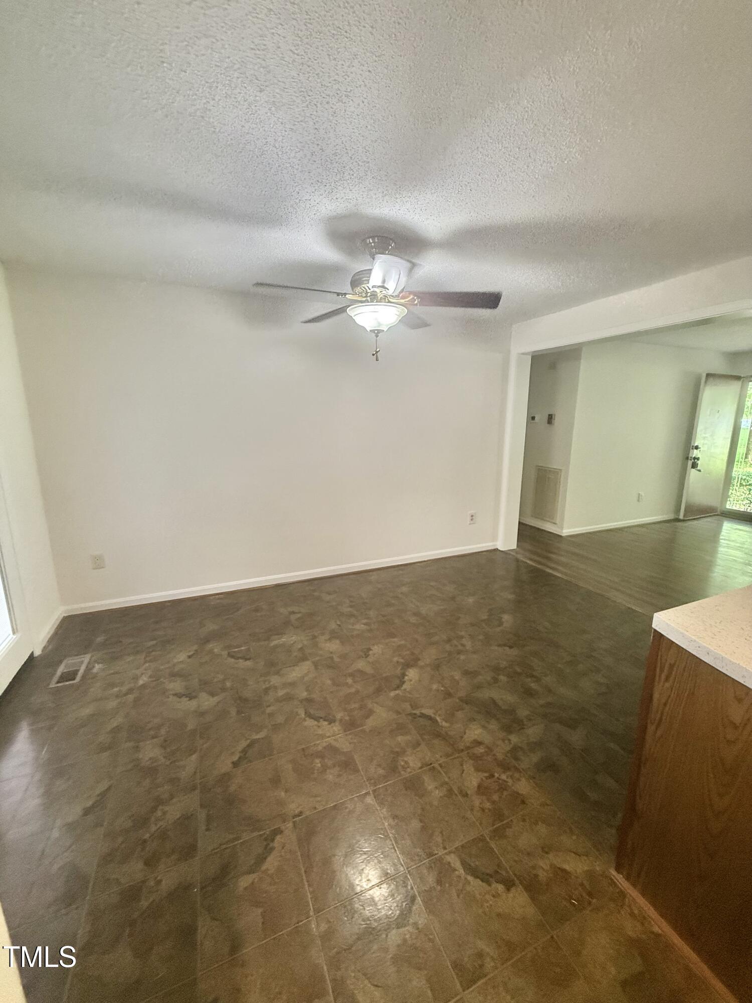 192 Misty Hollow Road Timberlake, NC 27583 - Photo 12 of 43 a view of a room with wooden floor and ceiling fan