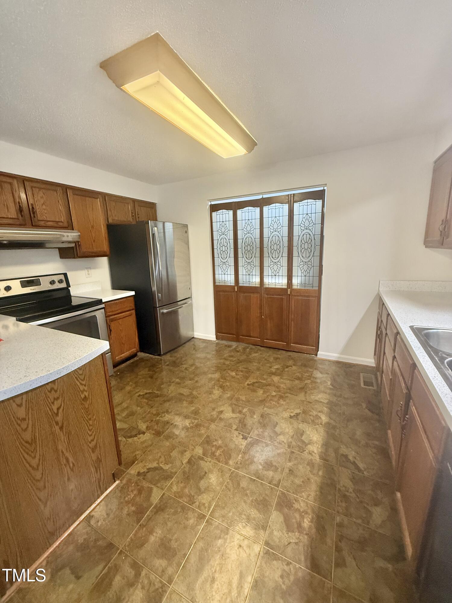 192 Misty Hollow Road Timberlake, NC 27583 - Photo 13 of 43 a view of an empty room with a window
