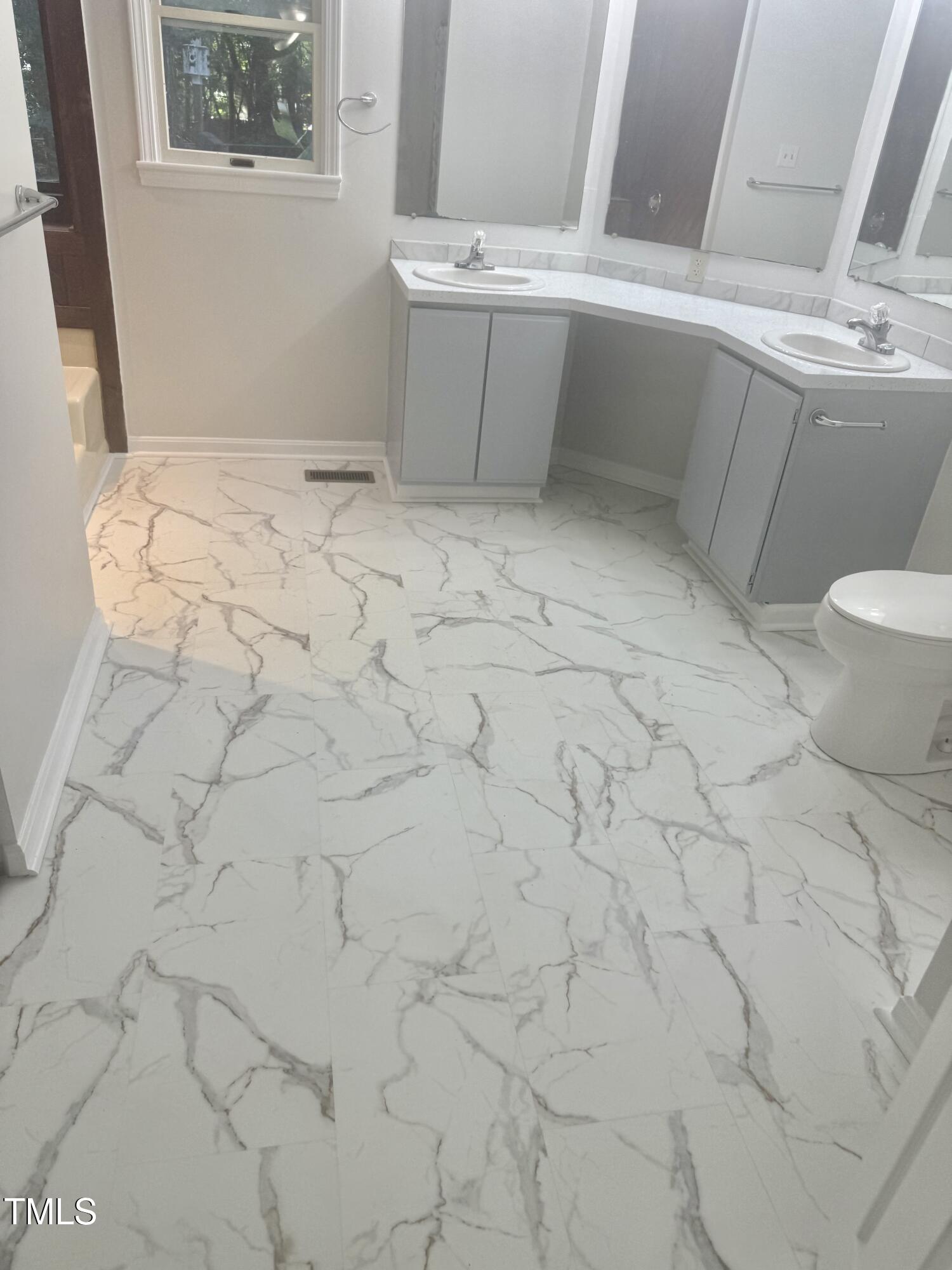 192 Misty Hollow Road Timberlake, NC 27583 - Photo 20 of 43 a bathroom with a sink and toilet