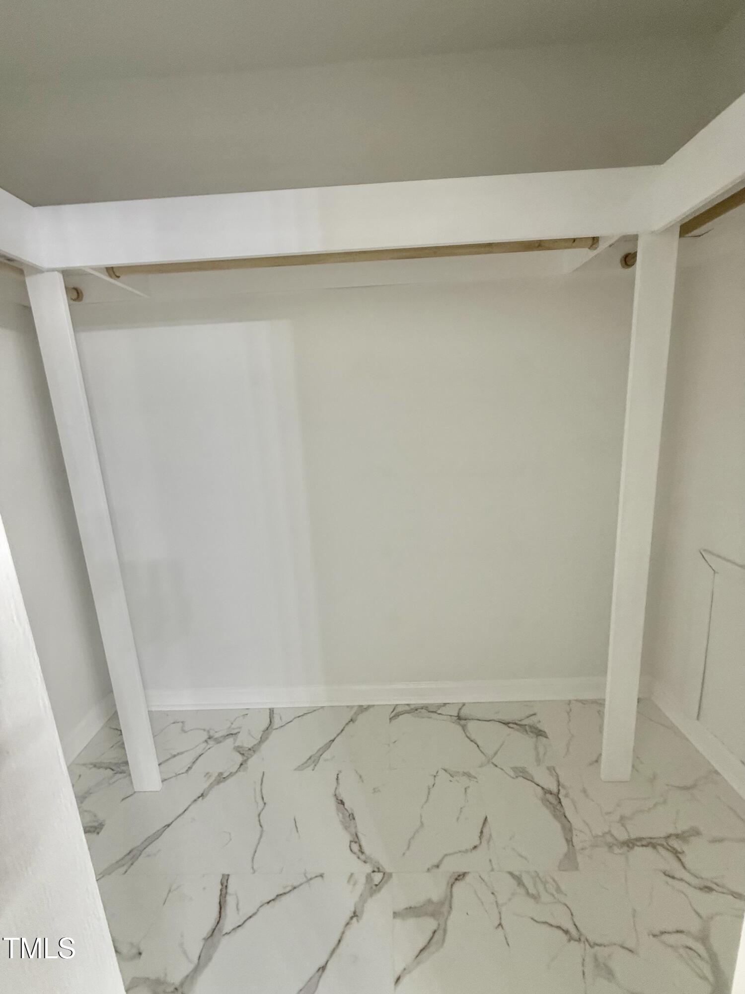 192 Misty Hollow Road Timberlake, NC 27583 - Photo 27 of 43 a view of a room with racks on the wall