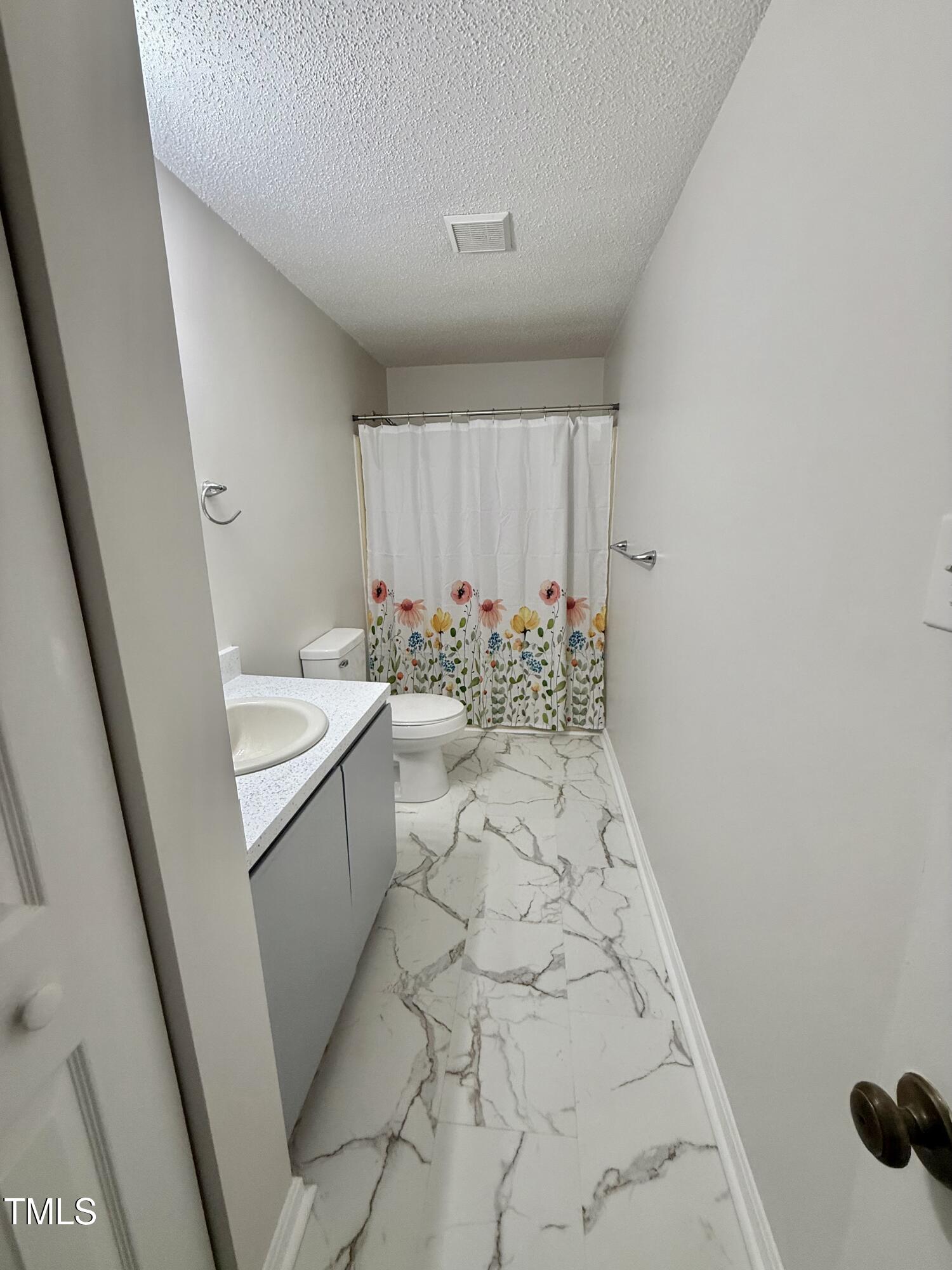 192 Misty Hollow Road Timberlake, NC 27583 - Photo 29 of 43 a bathroom with a sink toilet and shower