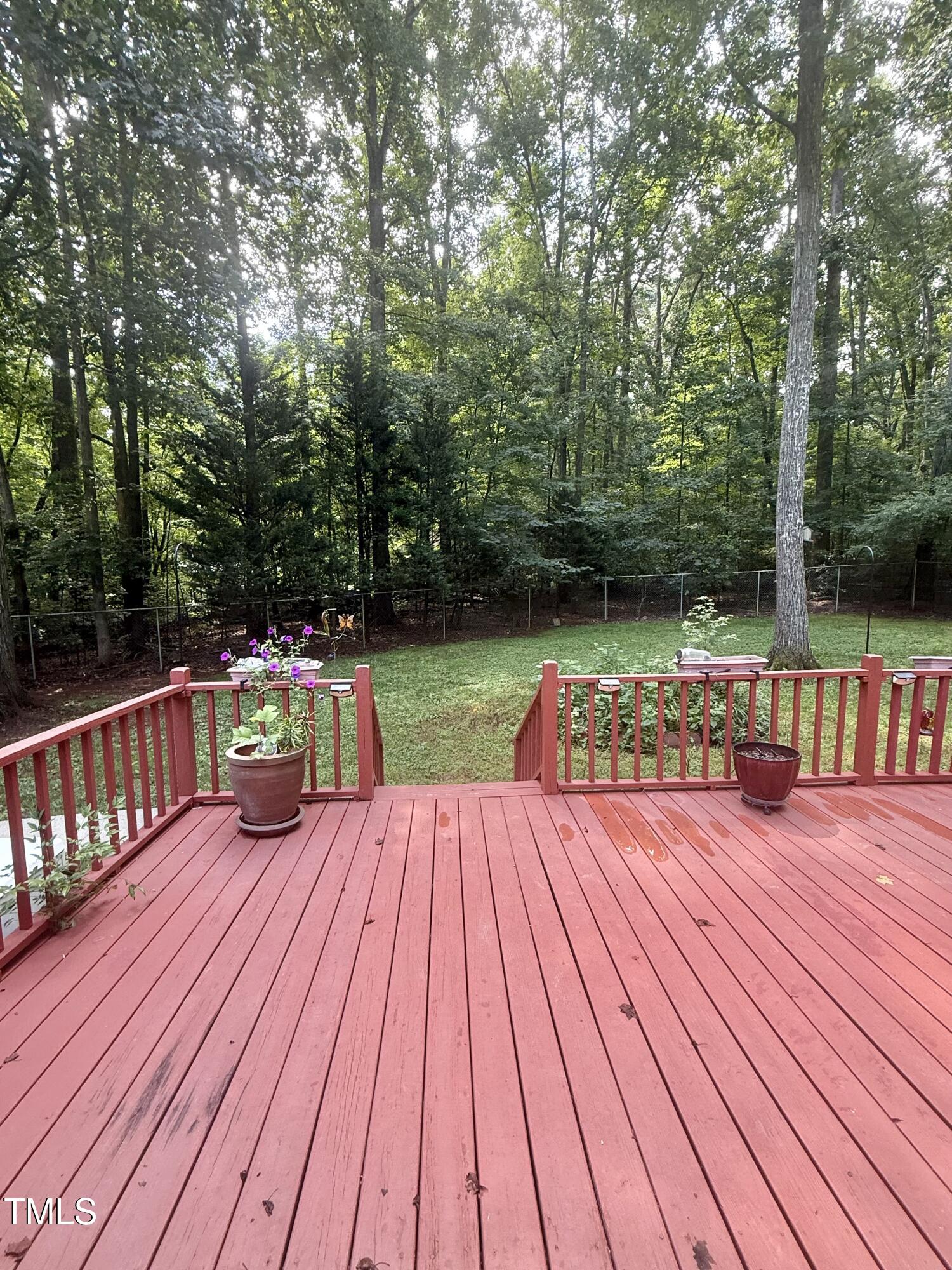 192 Misty Hollow Road Timberlake, NC 27583 - Photo 35 of 43 a view of deck with seating space and trees