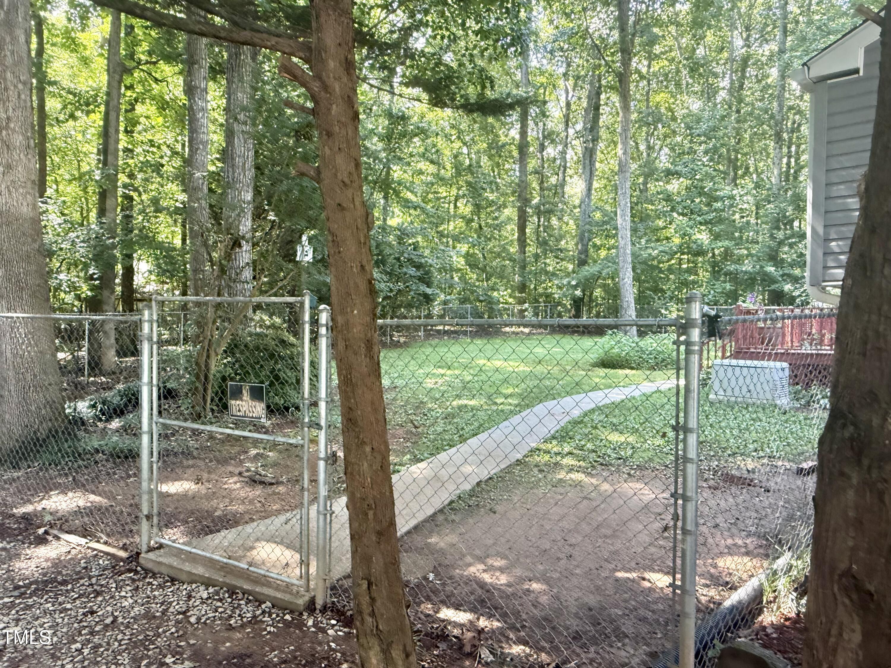 192 Misty Hollow Road Timberlake, NC 27583 - Photo 37 of 43 a view of a yard with a tree