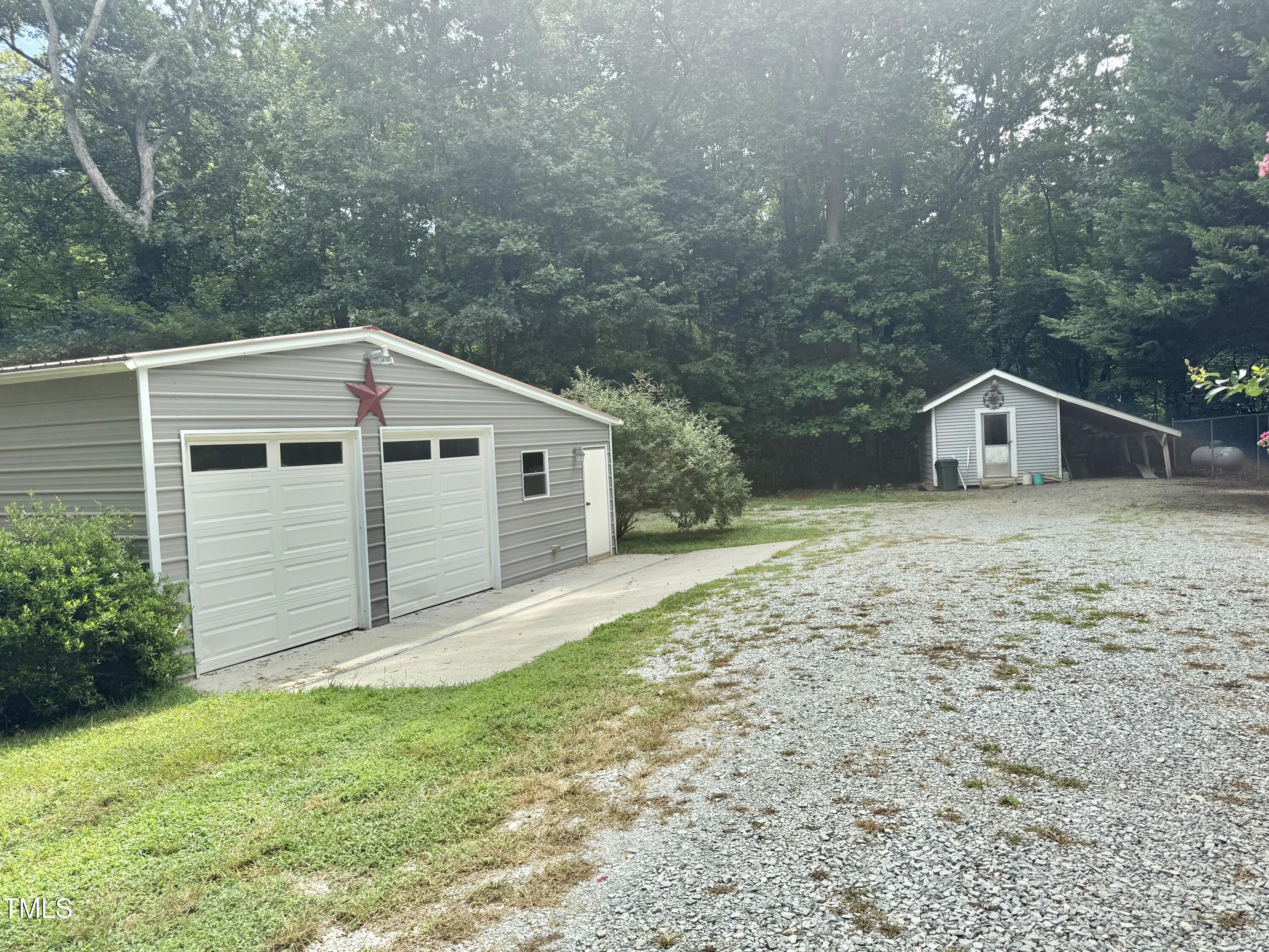 192 Misty Hollow Road Timberlake, NC 27583 - Photo 41 of 43 a view of a house with a yard