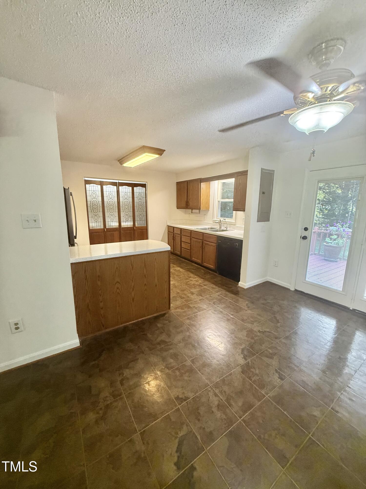 192 Misty Hollow Road Timberlake, NC 27583 - Photo 6 of 43 a living room with a couch and chandelier