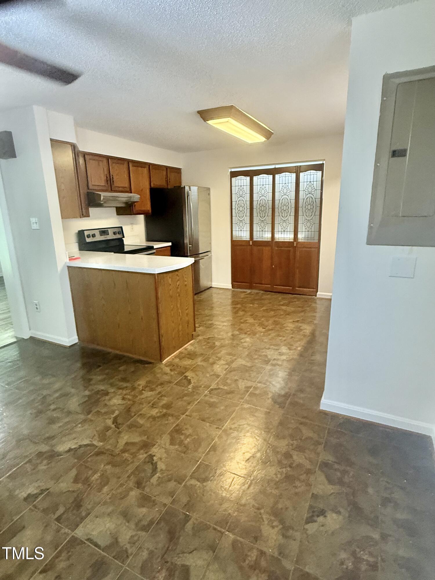 192 Misty Hollow Road Timberlake, NC 27583 - Photo 9 of 43 a view of kitchen with stainless steel appliances granite countertop cabinets and window