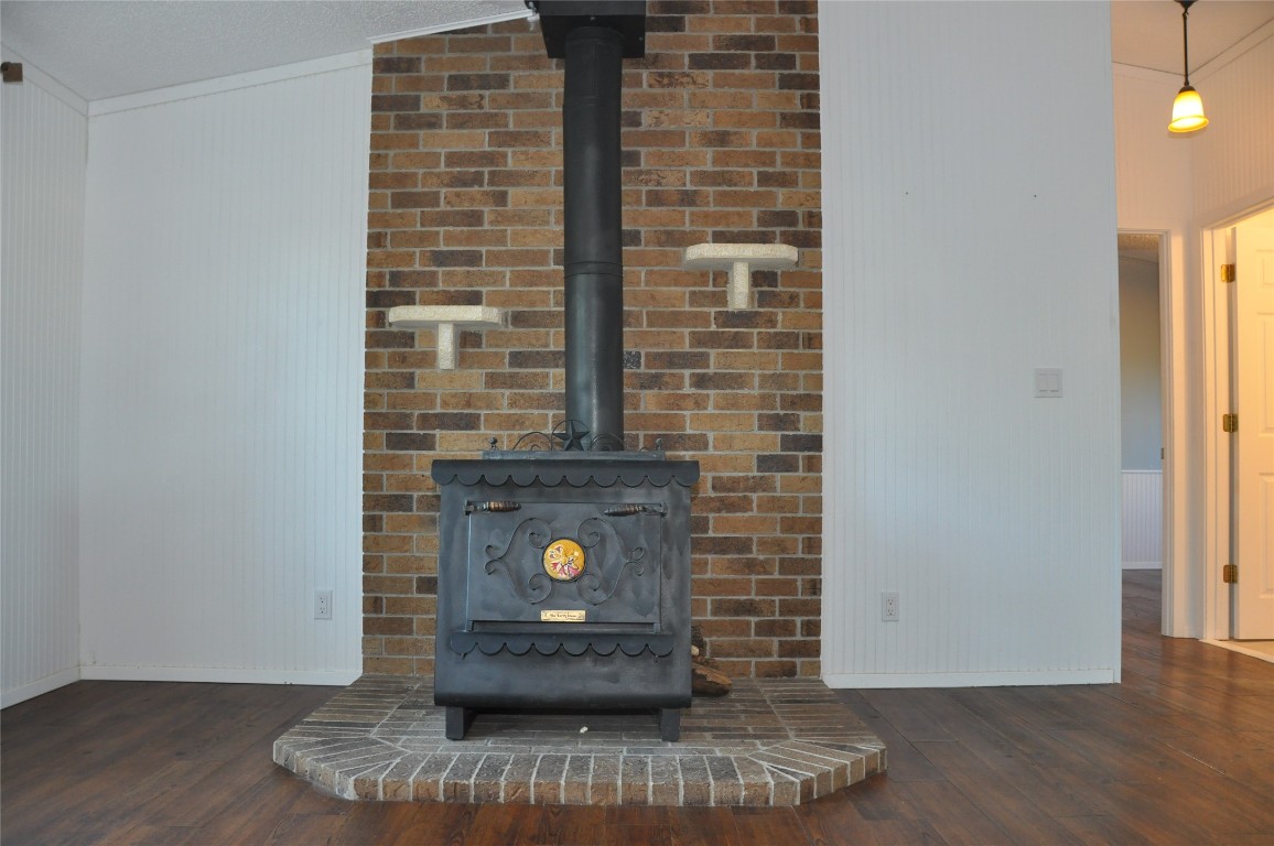 367 Mesquite Street Bertram, TX 78605 - Photo 16 of 23 a view of water heater room with wooden floor