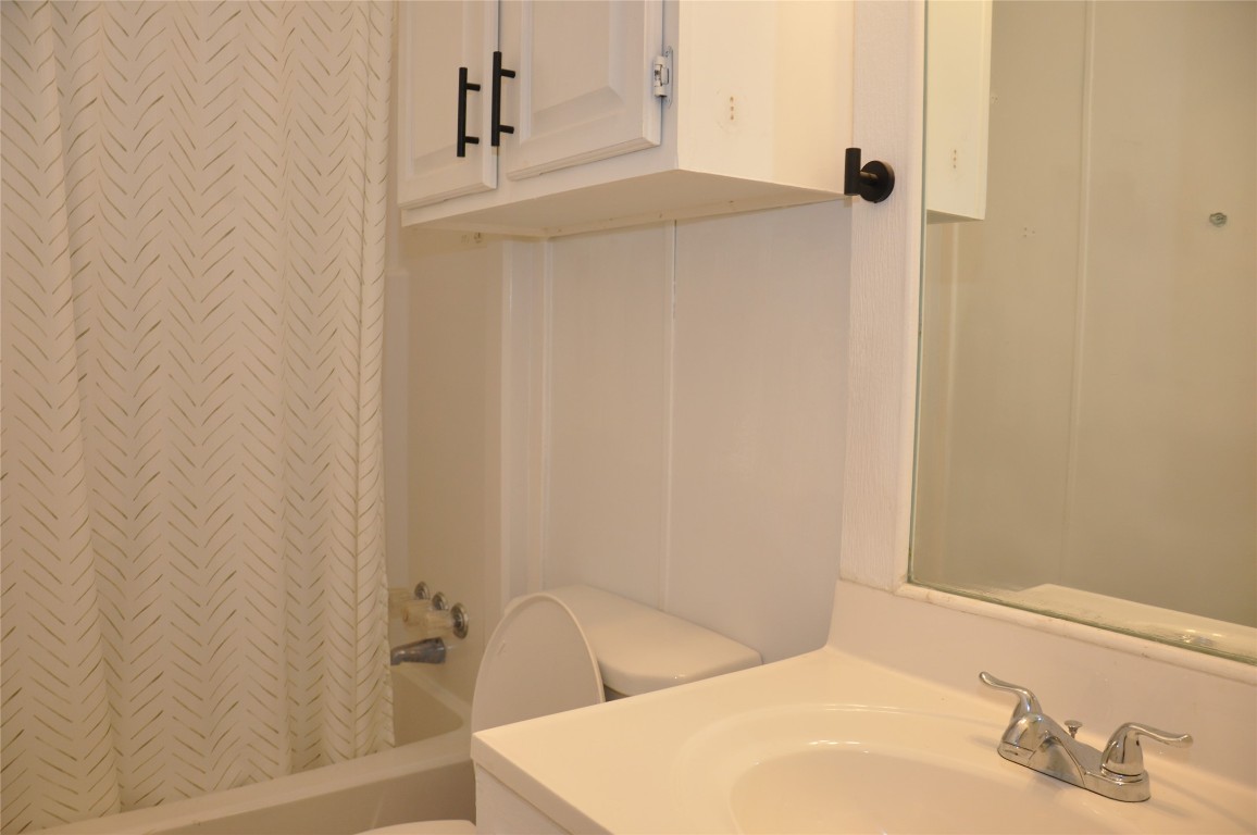367 Mesquite Street Bertram, TX 78605 - Photo 17 of 23 a bathroom with a sink and a tub