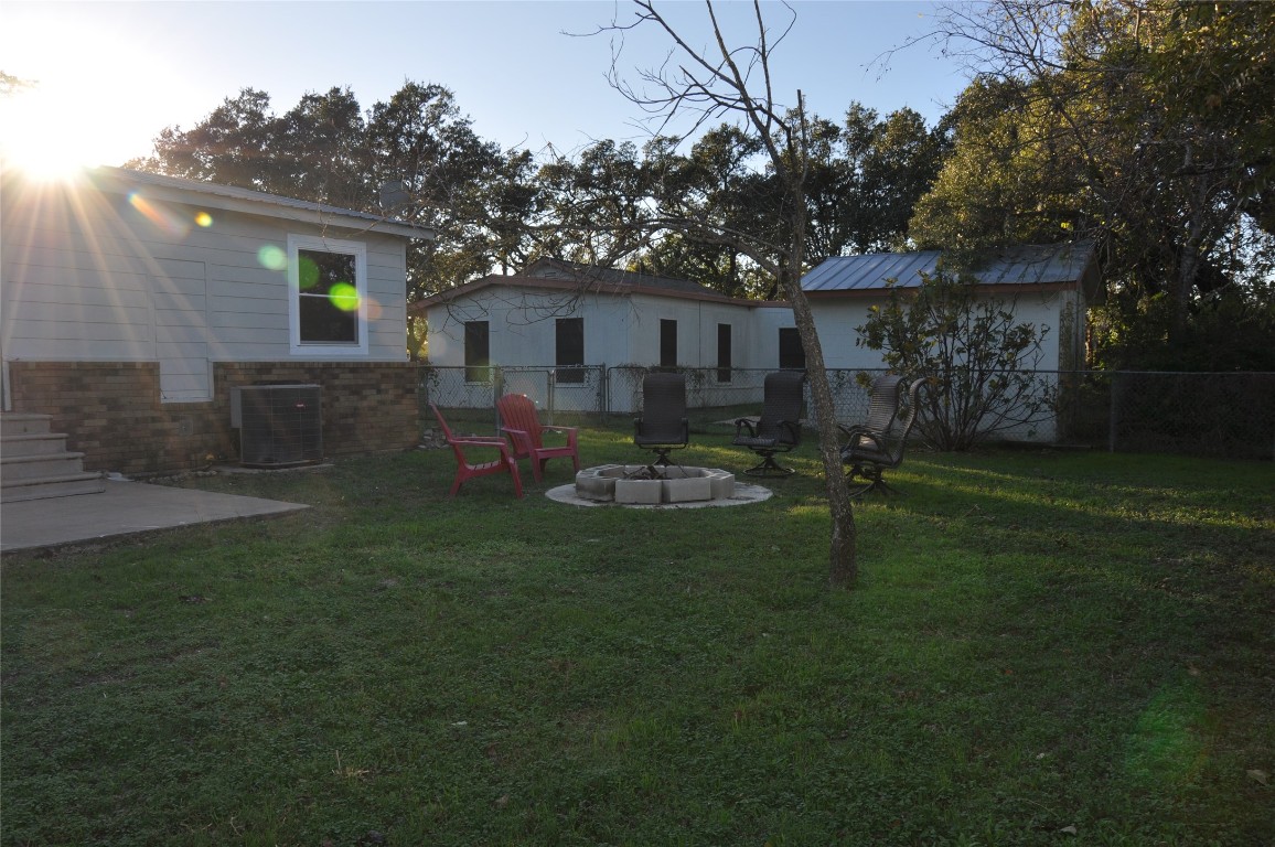 367 Mesquite Street Bertram, TX 78605 - Photo 21 of 23 a backyard of a house with table and chairs
