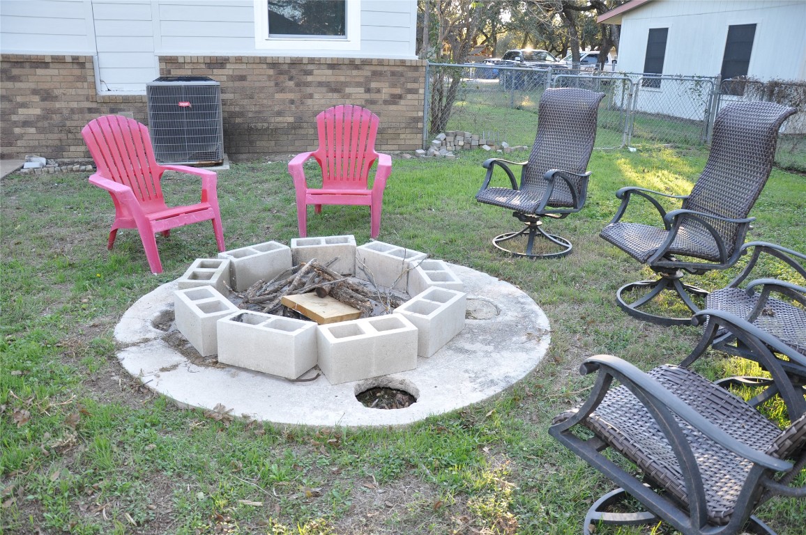 367 Mesquite Street Bertram, TX 78605 - Photo 22 of 23 a view of a chairs and table in backyard
