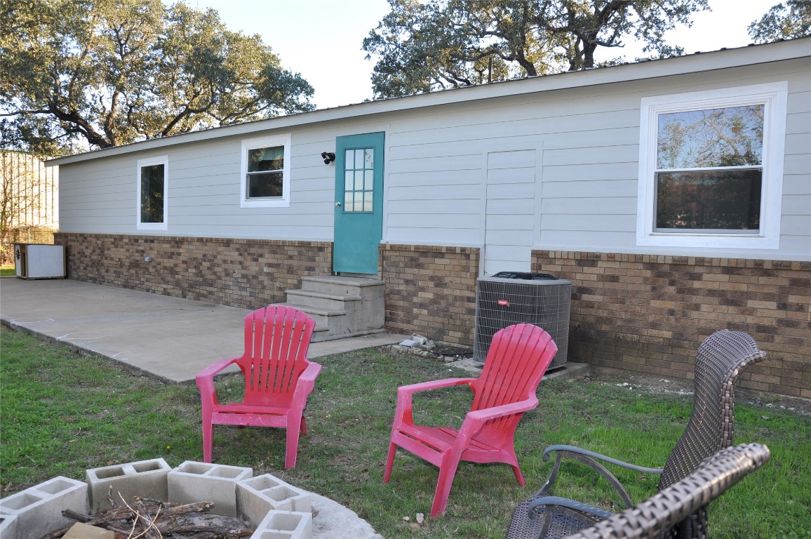 367 Mesquite Street Bertram, TX 78605 - Photo 23 of 23 a backyard of a house with outdoor seating