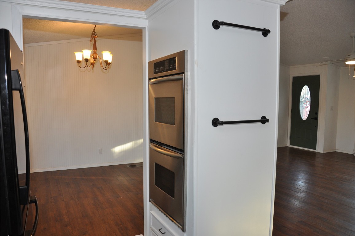 367 Mesquite Street Bertram, TX 78605 - Photo 9 of 23 a view of a hallway with wooden floor