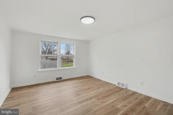 an empty room with a empty space and window