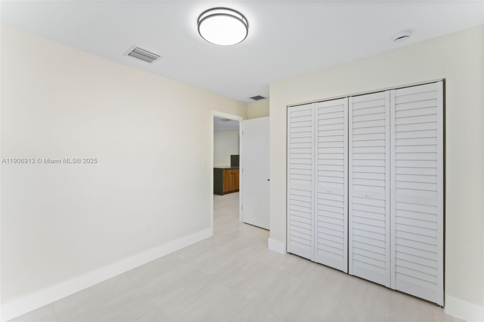 1171 Northwest 66th Street Miami, FL 33150 - Photo 14 of 34 a view of an empty room