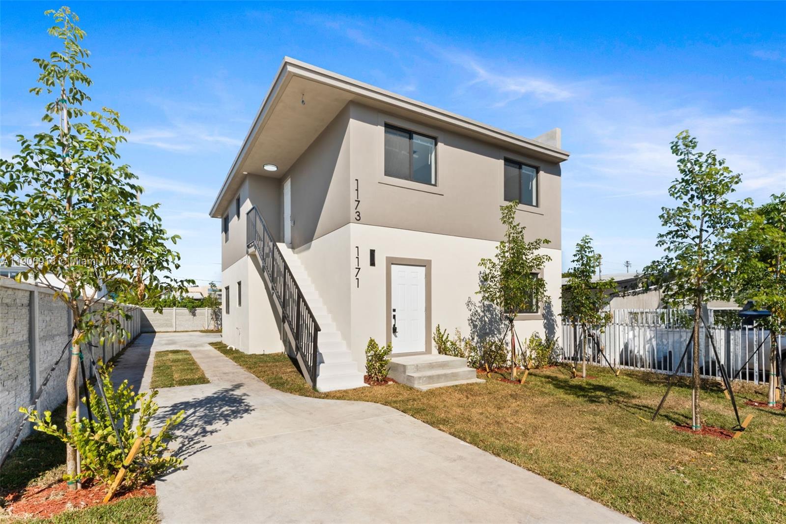 1171 Northwest 66th Street Miami, FL 33150 - Photo 2 of 34 a view of a house with basketball court