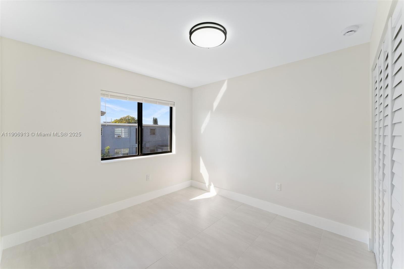 1171 Northwest 66th Street Miami, FL 33150 - Photo 27 of 34 a view of a hallway with window