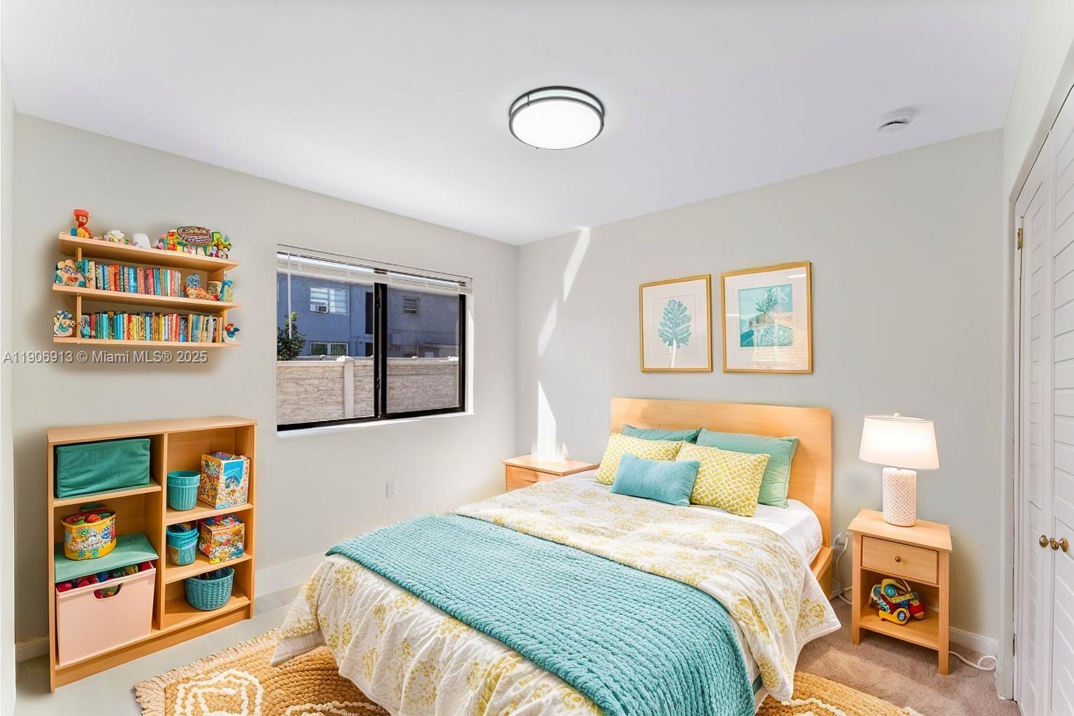 1171 Northwest 66th Street Miami, FL 33150 - Photo 10 of 34 a bedroom with a bed and painting on the wall