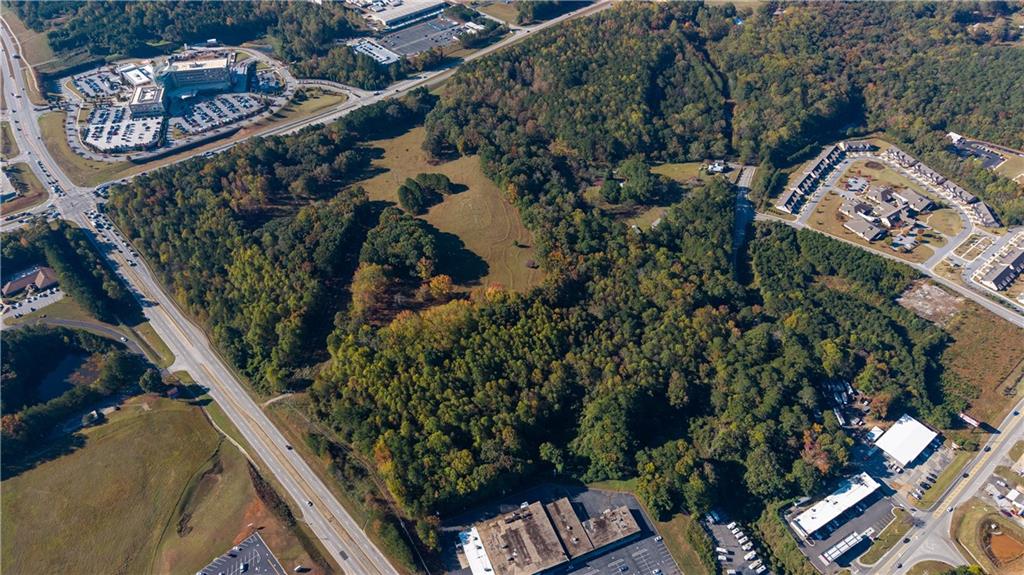 an aerial view of a residential houses with outdoor space