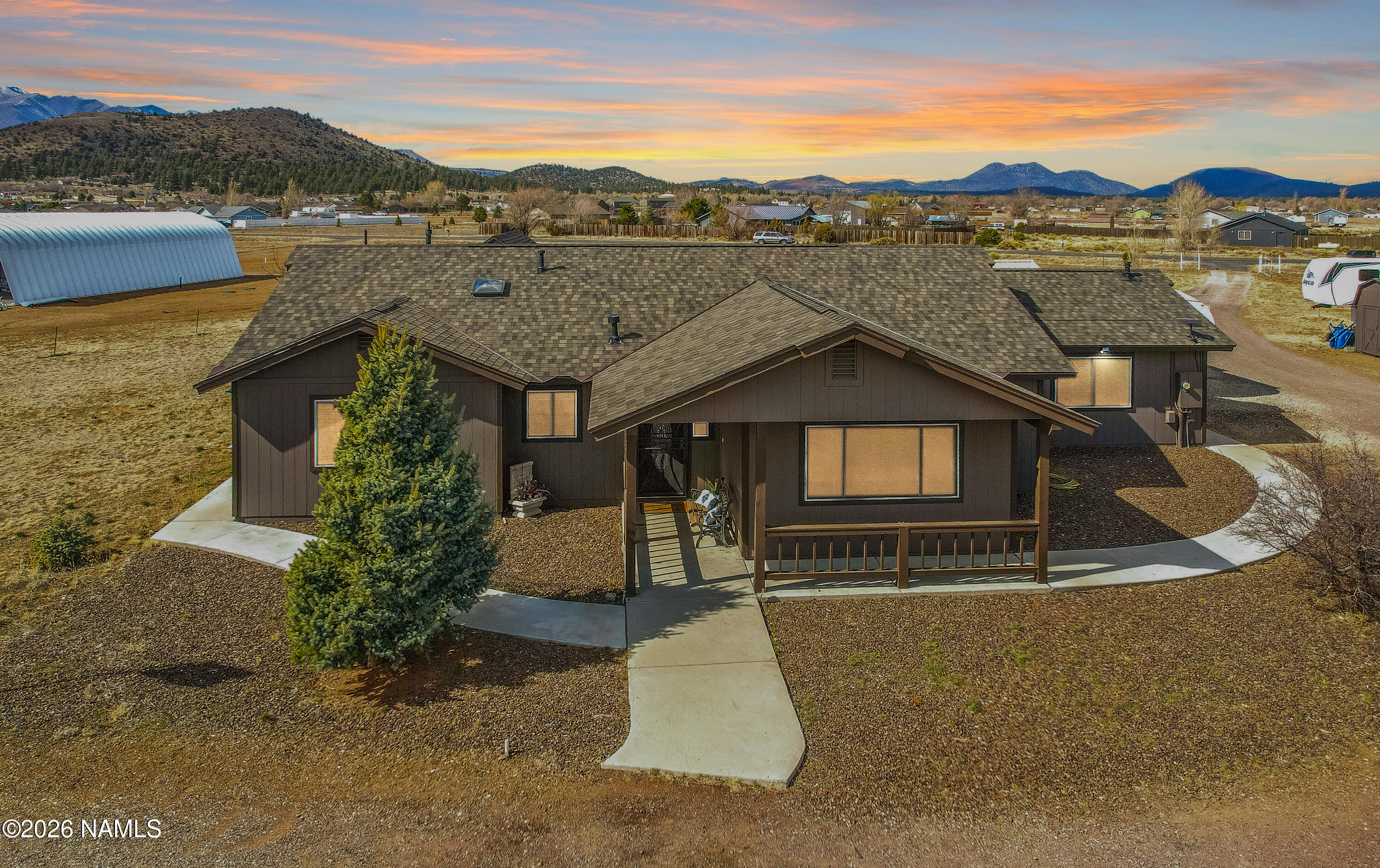 7725 Alma Road Flagstaff, AZ 86004 - Photo 1 of 38 a house with river in front of it