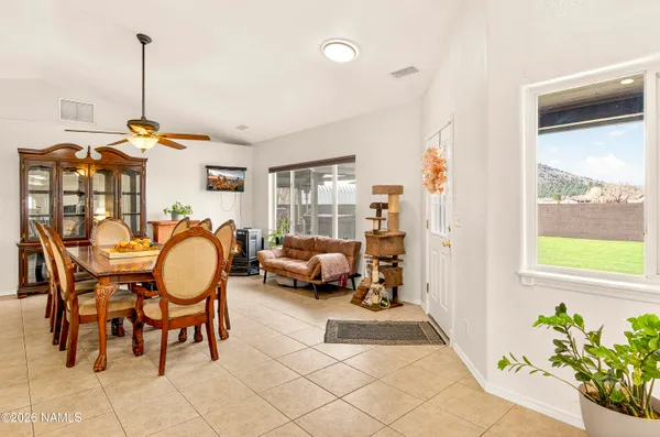 a very nice looking room with a large window and furniture