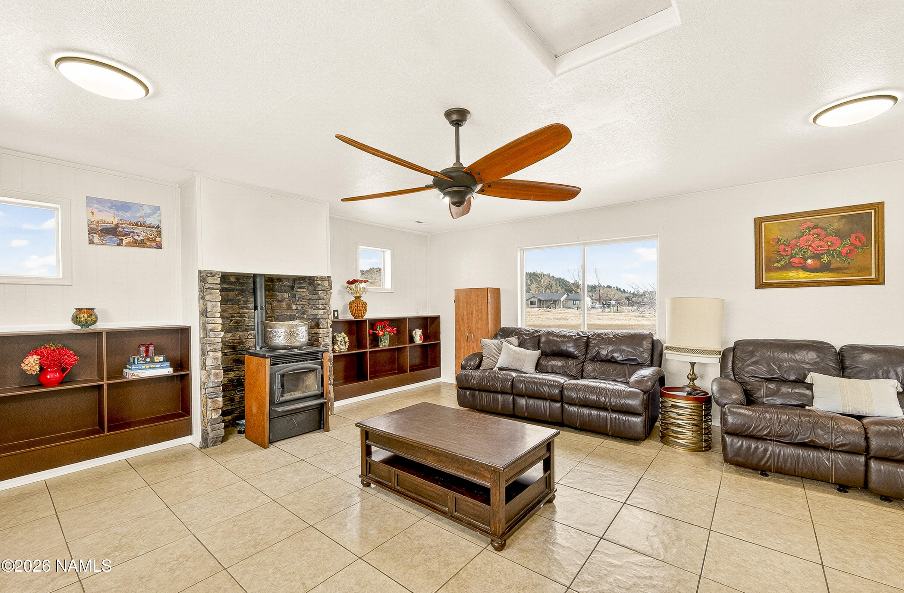 7725 Alma Road Flagstaff, AZ 86004 - Photo 14 of 38 a living room with furniture and kitchen view