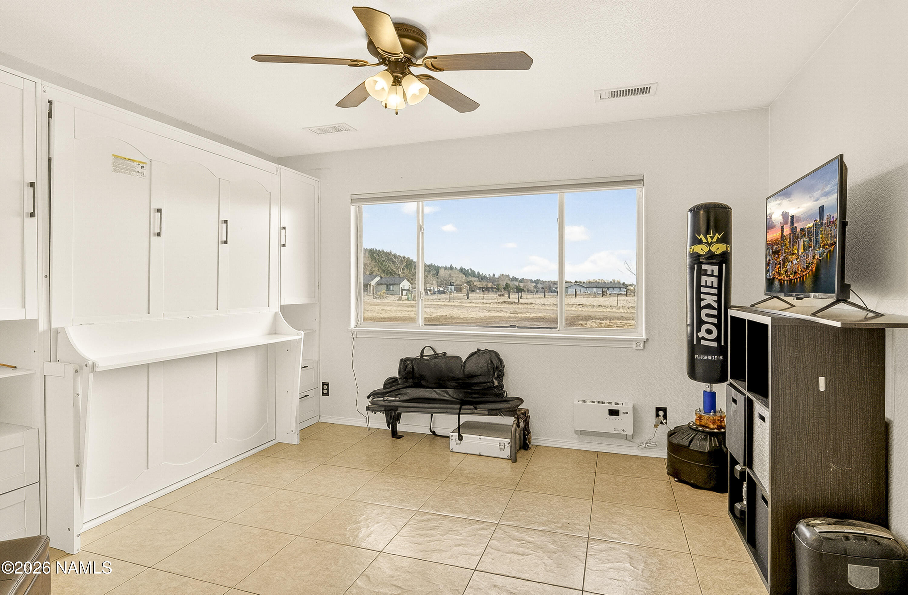 7725 Alma Road Flagstaff, AZ 86004 - Photo 20 of 38 a workspace with furniture and window