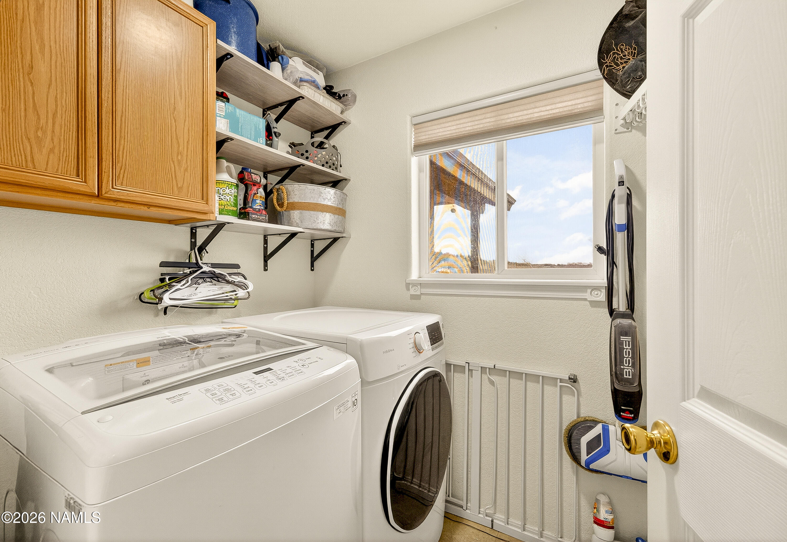 7725 Alma Road Flagstaff, AZ 86004 - Photo 25 of 38 a utility room with dryer and washer