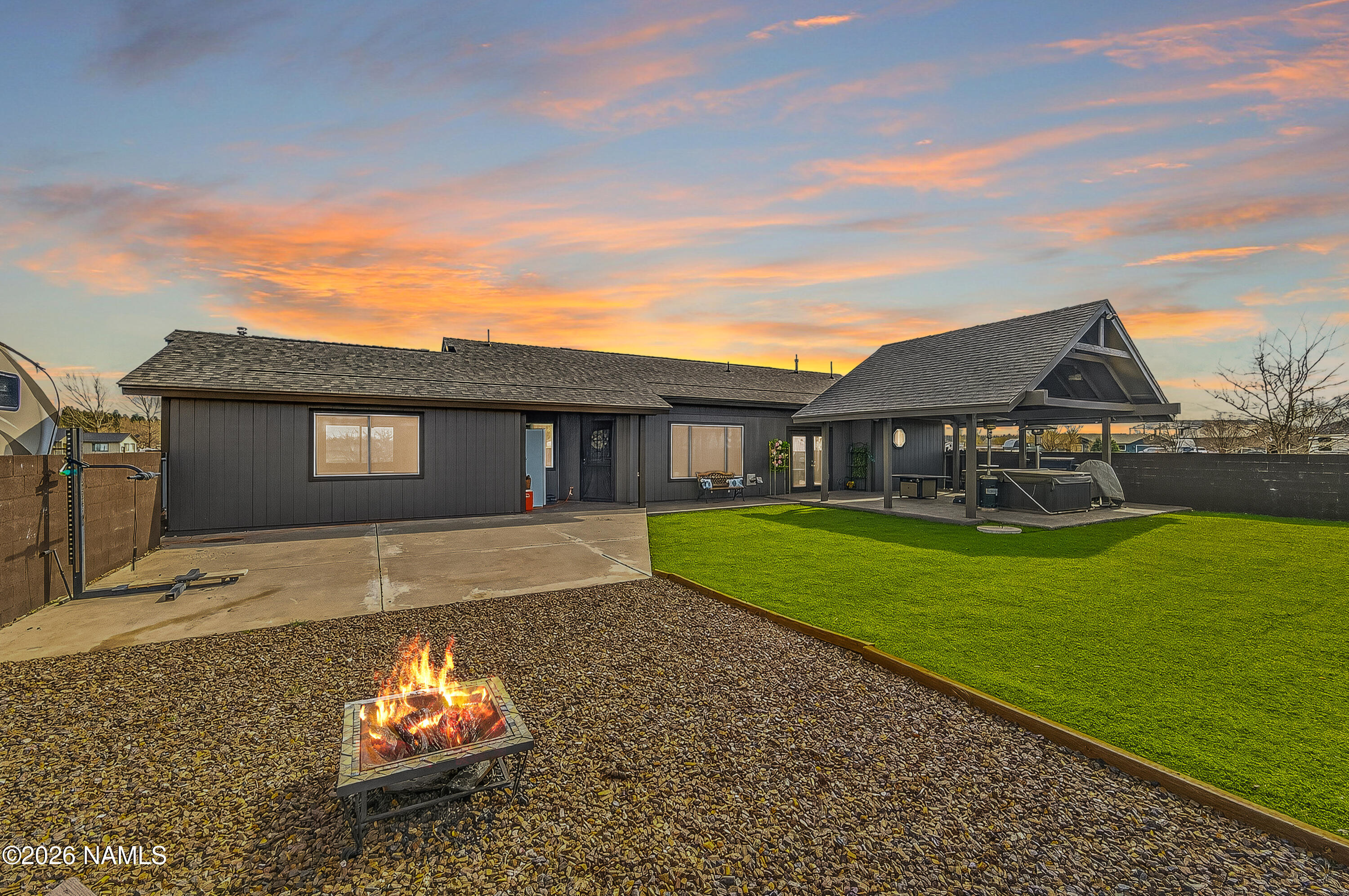 7725 Alma Road Flagstaff, AZ 86004 - Photo 29 of 38 a view of a yard with a house and a garden