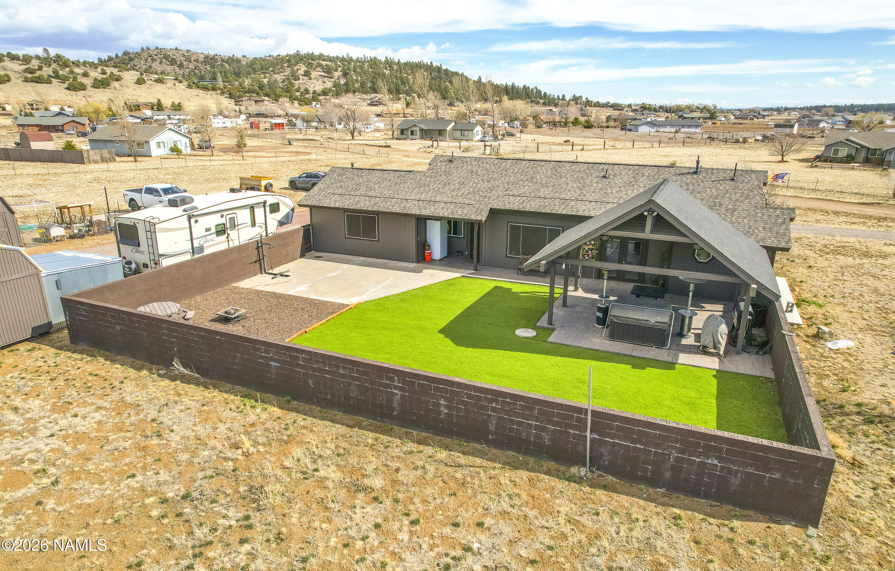 7725 Alma Road Flagstaff, AZ 86004 - Photo 30 of 38 a view of a house with a outdoor space