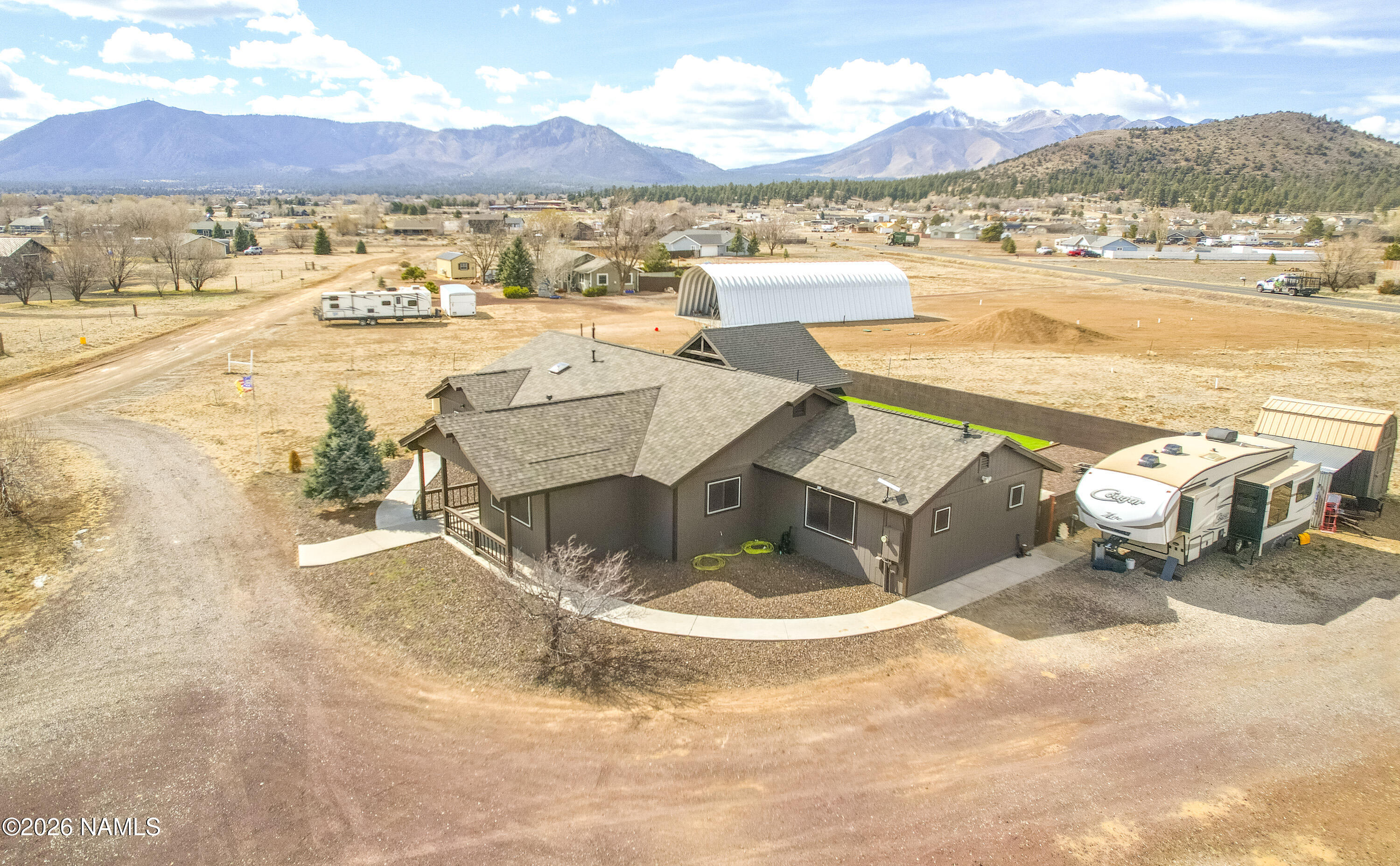 7725 Alma Road Flagstaff, AZ 86004 - Photo 32 of 38 a view of a lake with a mountain