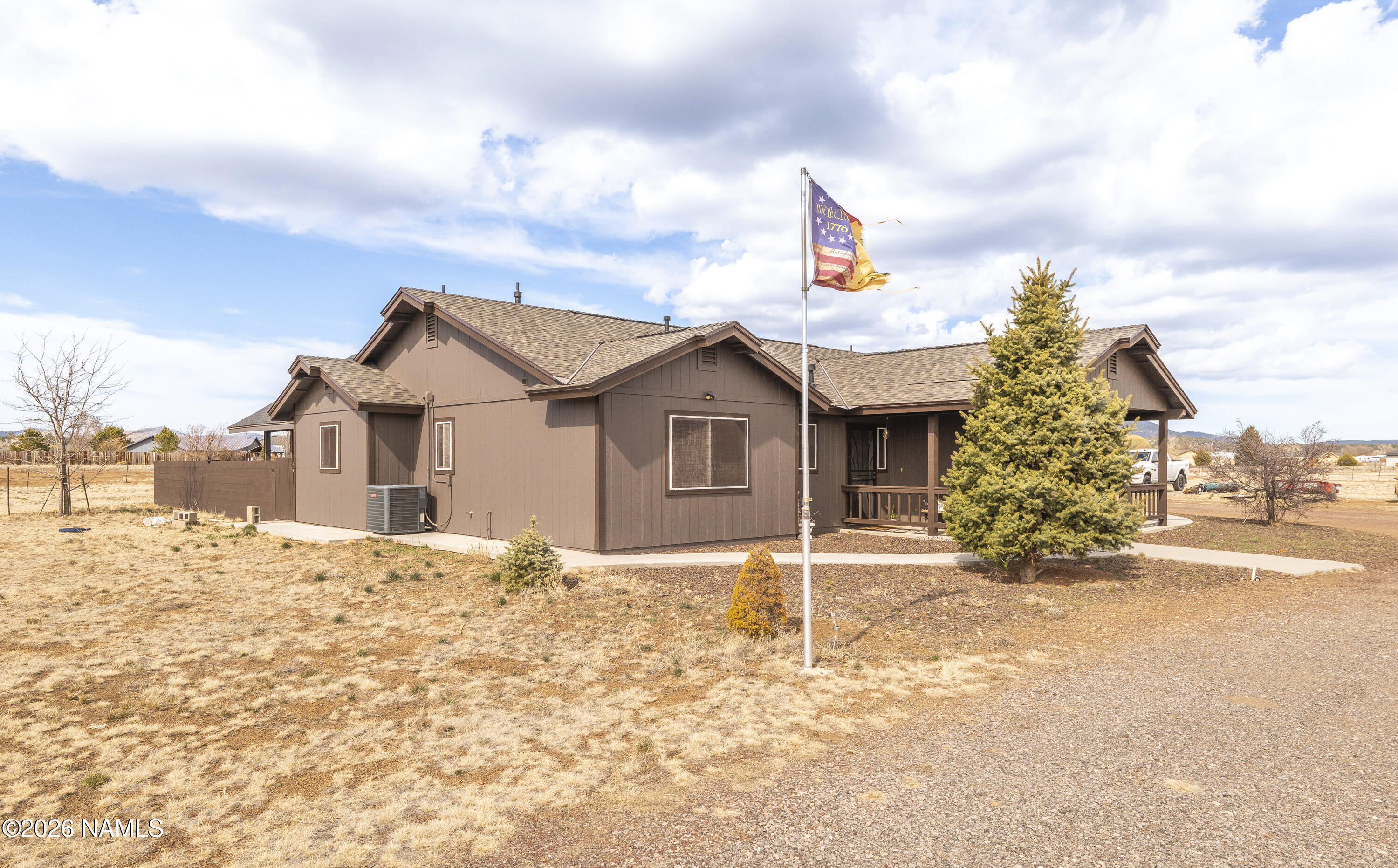 7725 Alma Road Flagstaff, AZ 86004 - Photo 38 of 38 a front view of a house with a yard