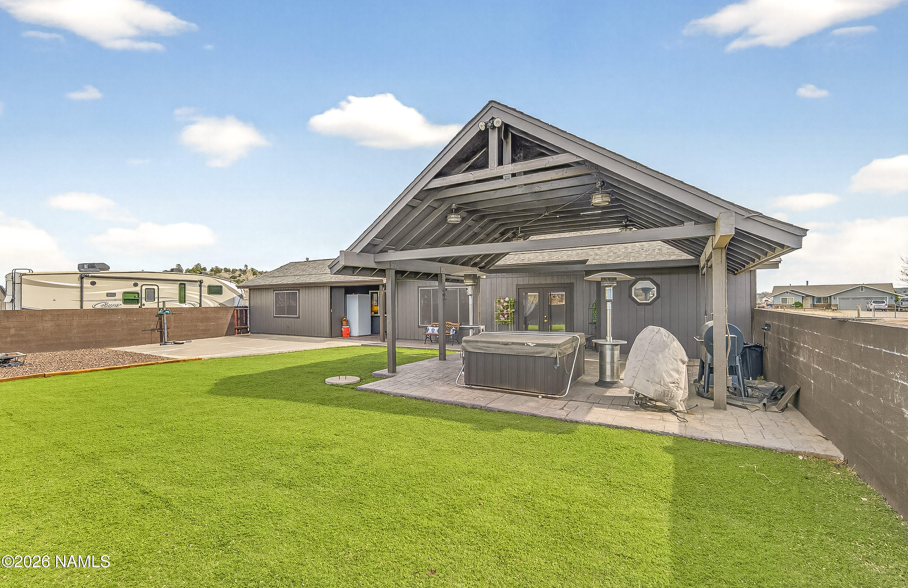 7725 Alma Road Flagstaff, AZ 86004 - Photo 5 of 38 a front view of a house with garden