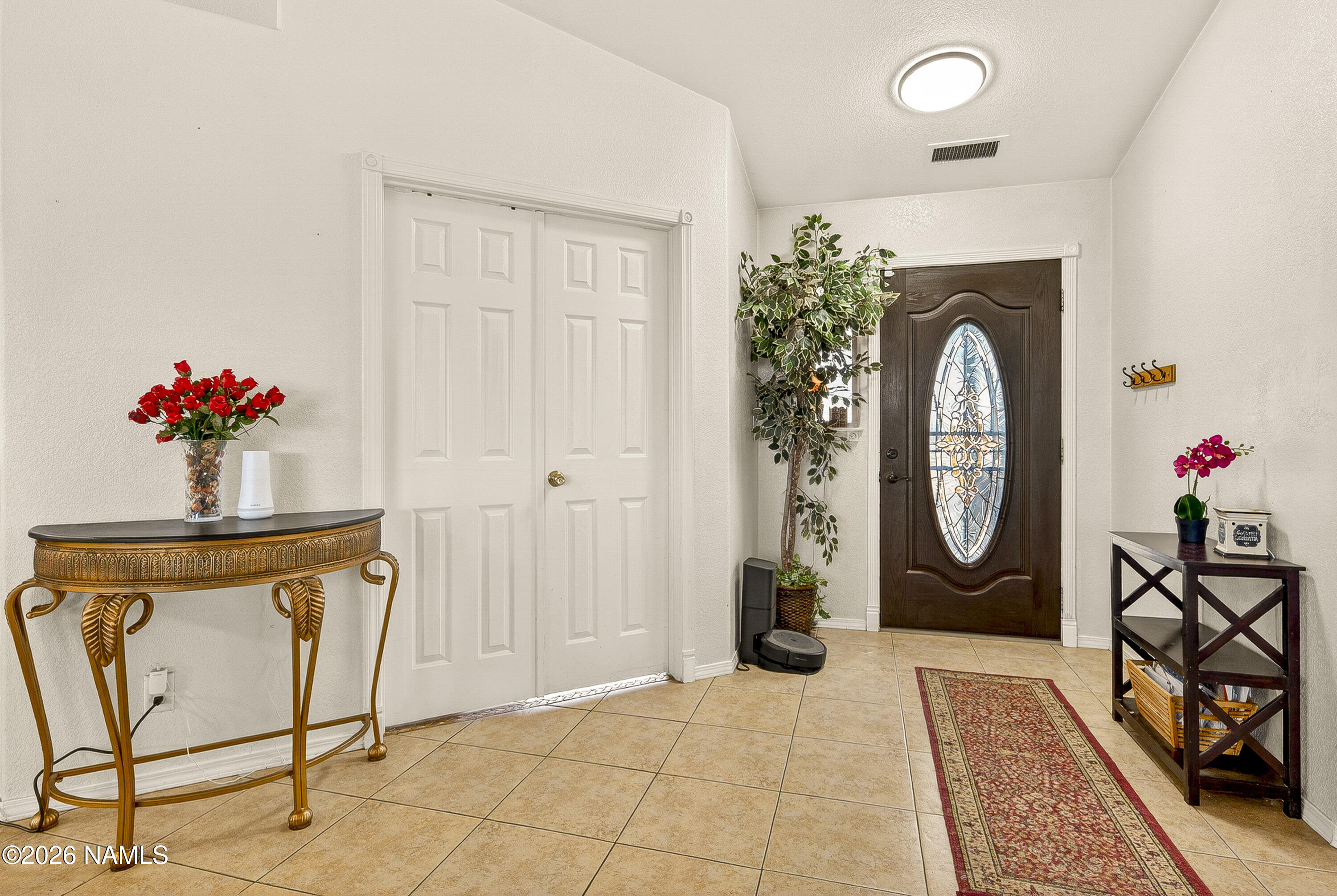 7725 Alma Road Flagstaff, AZ 86004 - Photo 6 of 38 a view of a entryway door front of a house