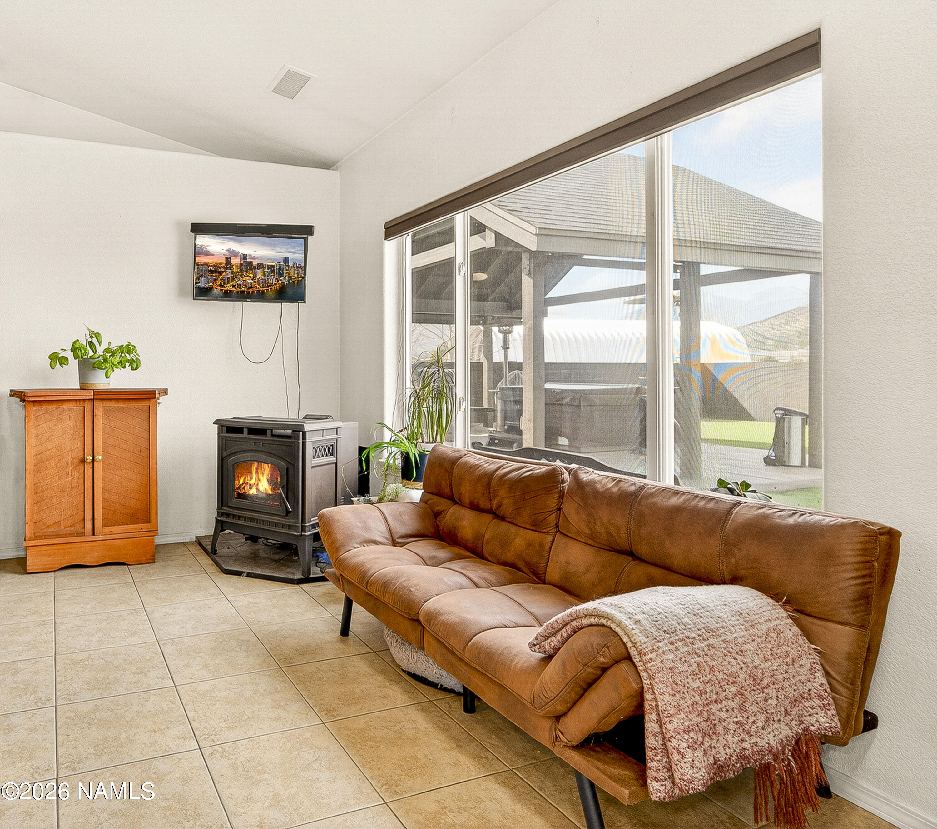 7725 Alma Road Flagstaff, AZ 86004 - Photo 10 of 38 a living room with furniture and a fireplace