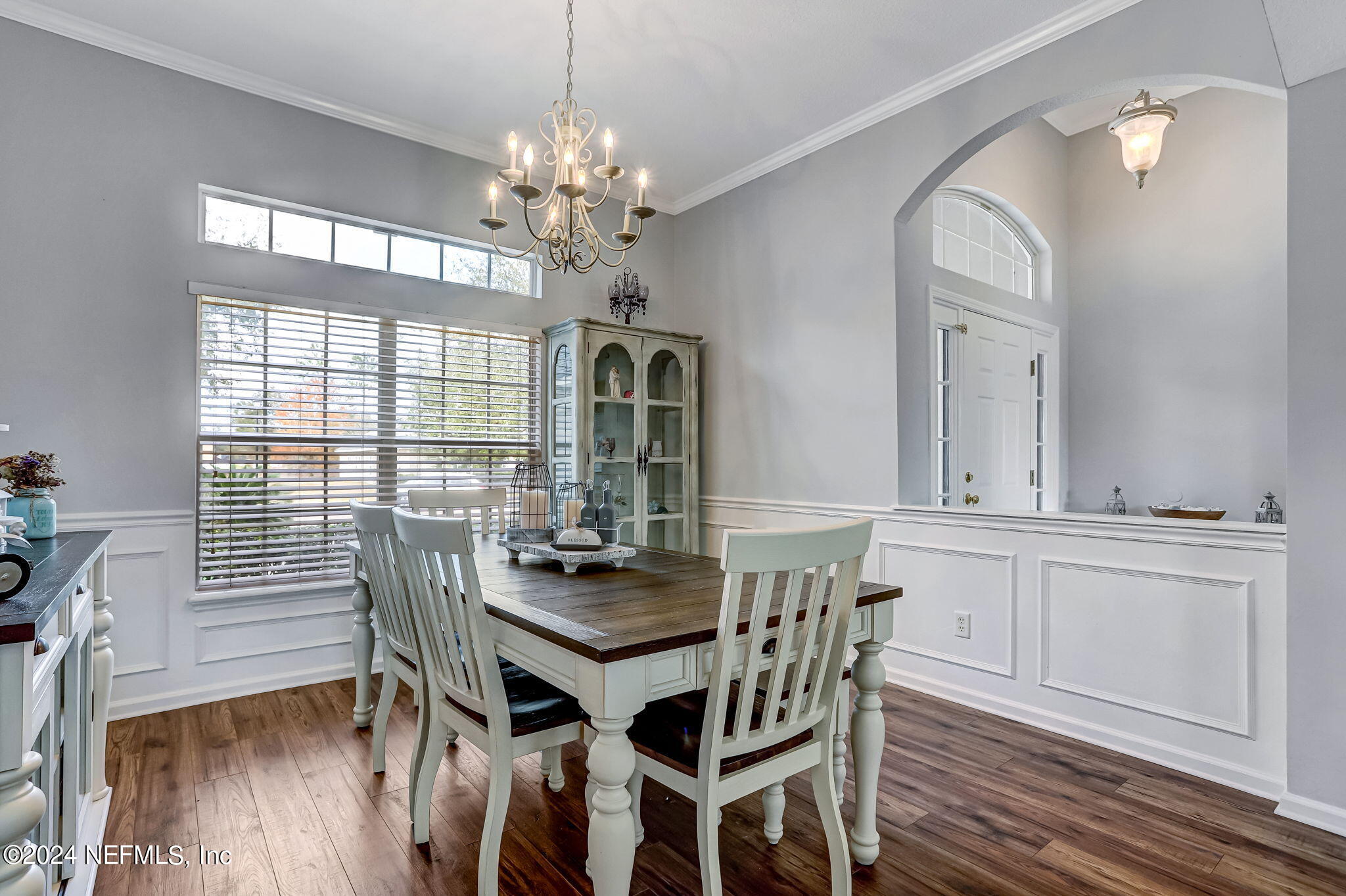 261 Porta Rosa Circle St. Augustine, FL 32092 - Photo 14 of 81 a view of a dining room with furniture a chandelier and wooden floor