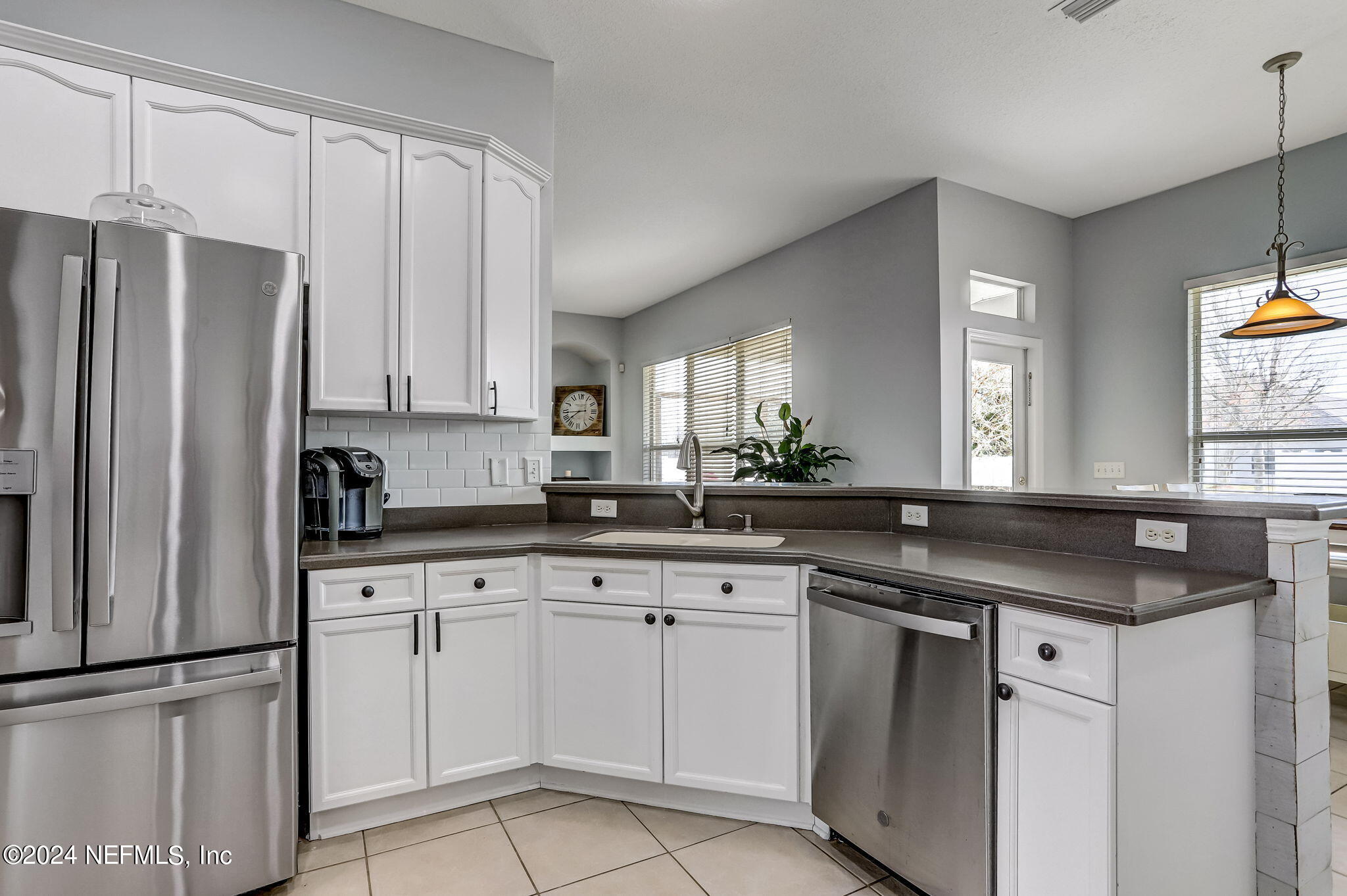 261 Porta Rosa Circle St. Augustine, FL 32092 - Photo 18 of 81 a kitchen with white cabinets and a sink