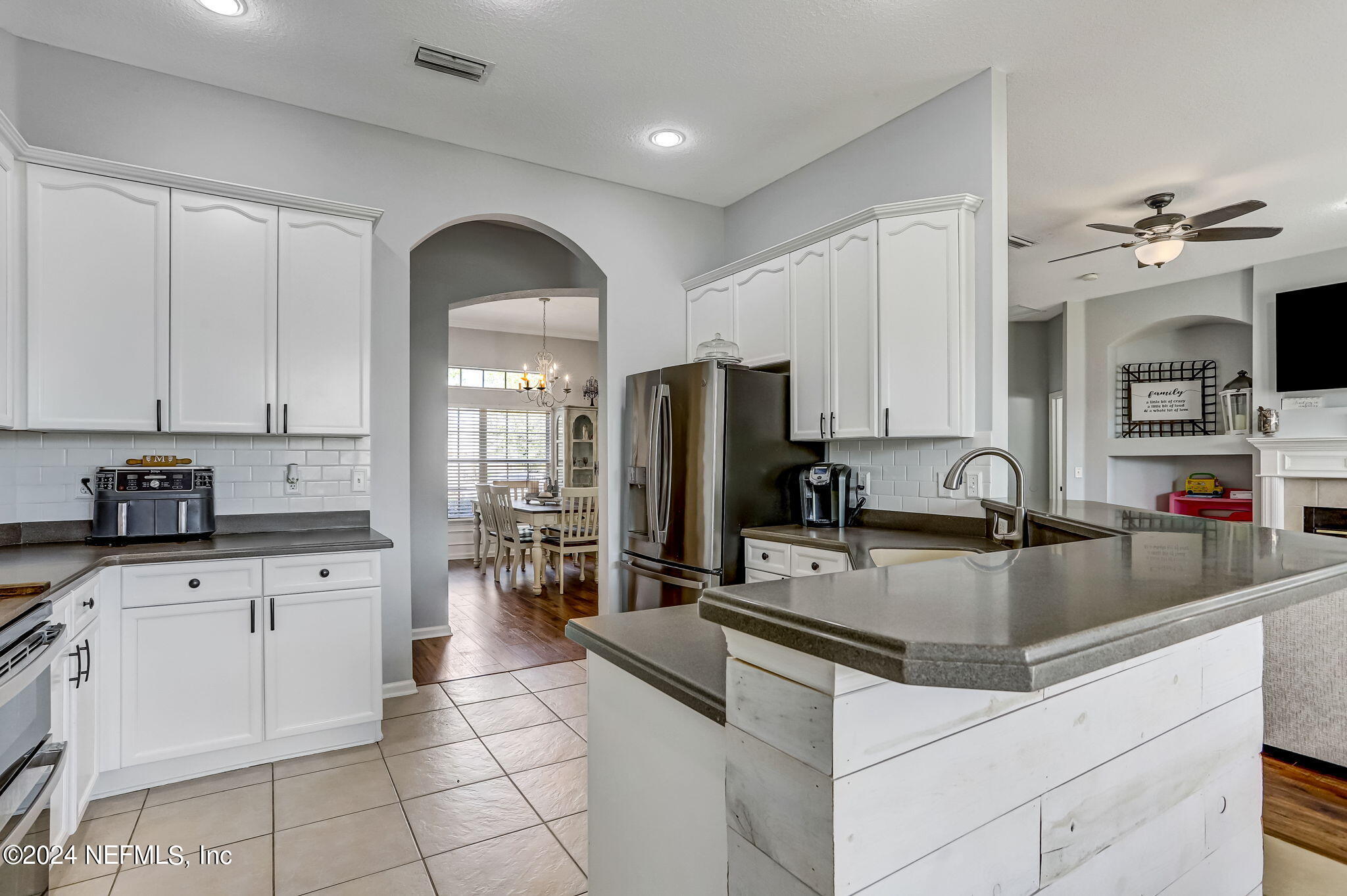 261 Porta Rosa Circle St. Augustine, FL 32092 - Photo 19 of 81 a kitchen with granite countertop a sink stainless steel appliances and white cabinets