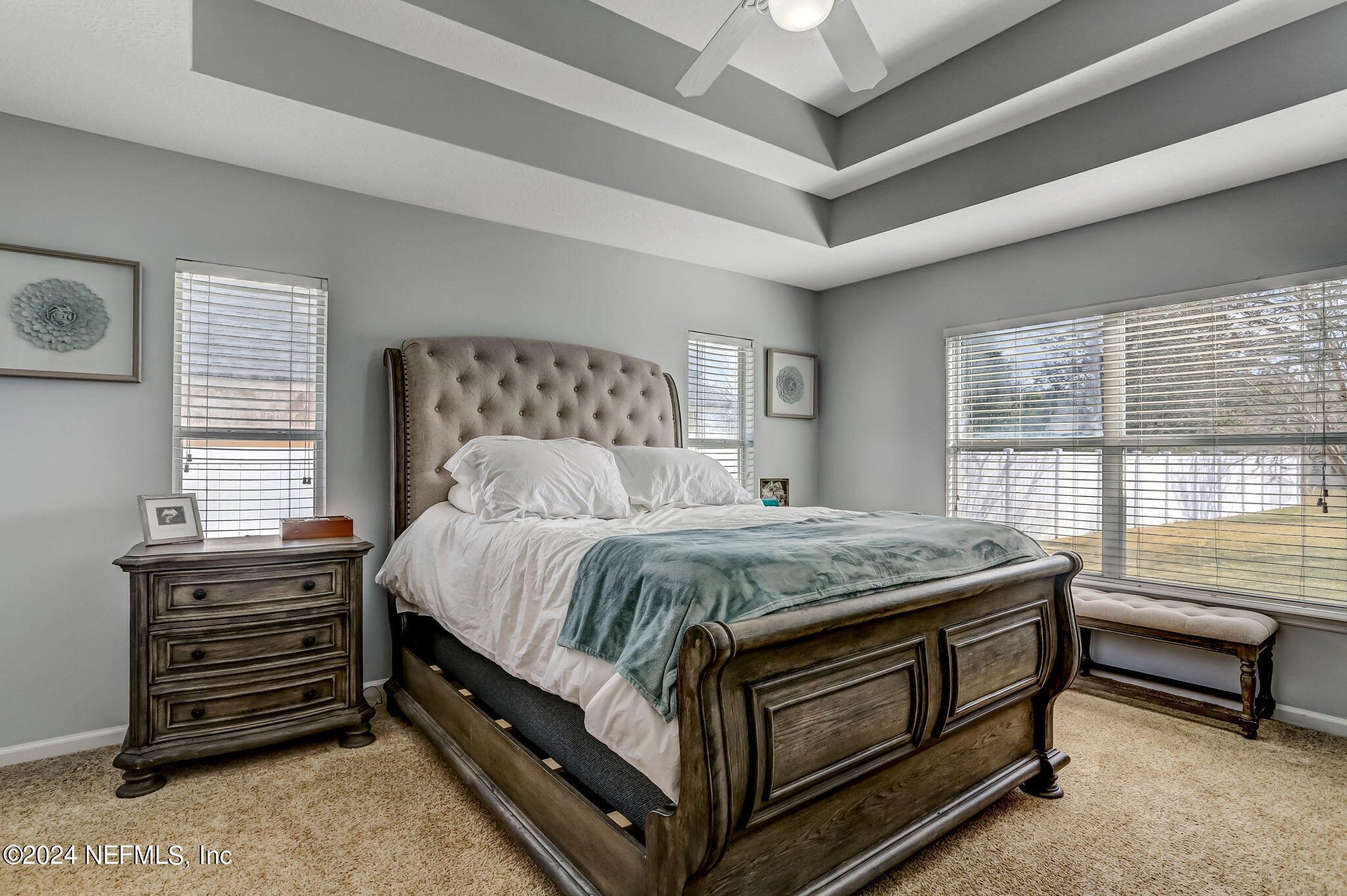 261 Porta Rosa Circle St. Augustine, FL 32092 - Photo 26 of 81 a bed sitting in a bedroom next to a window