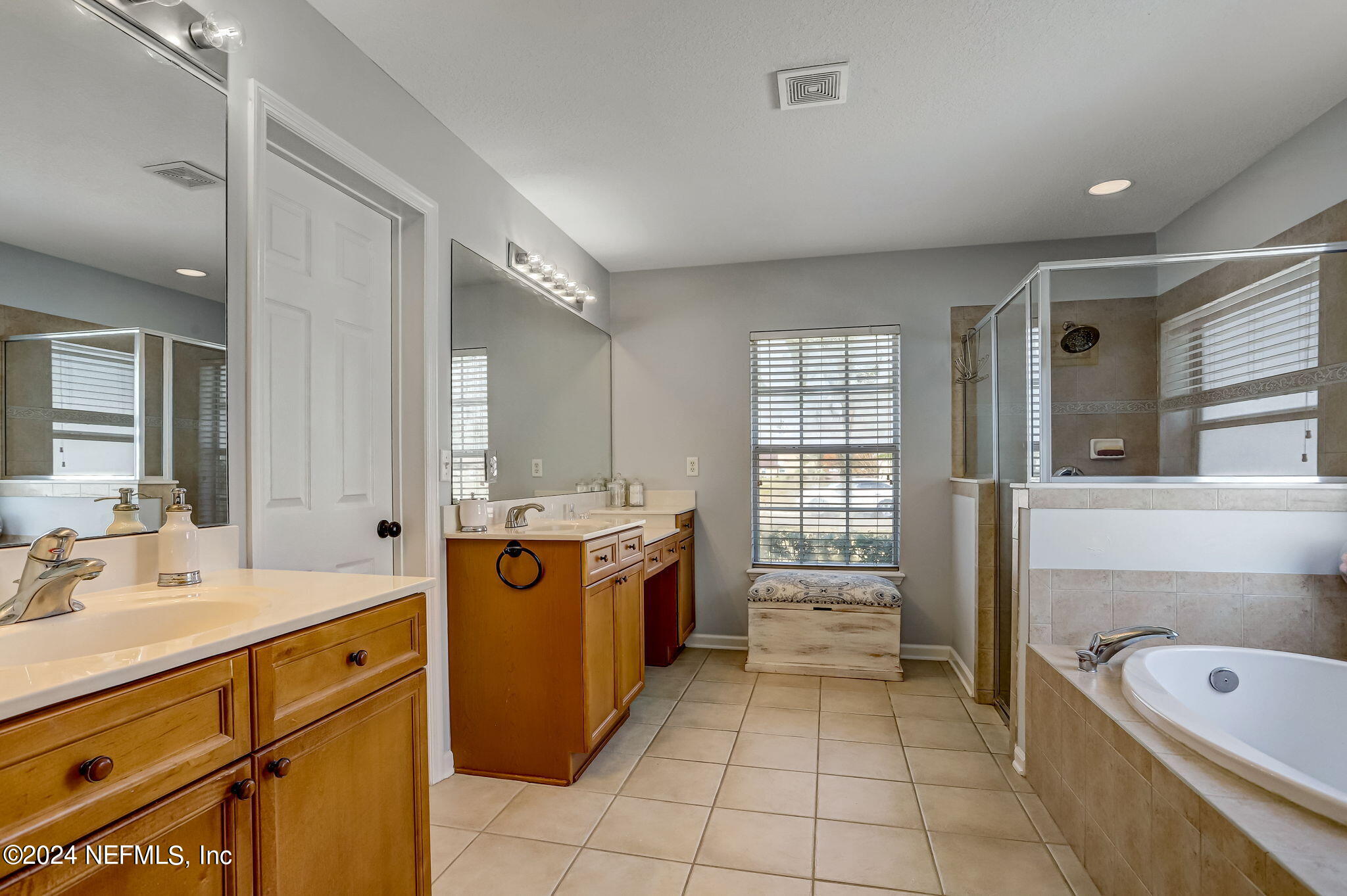 261 Porta Rosa Circle St. Augustine, FL 32092 - Photo 30 of 81 a large bathroom with a tub sink and mirror