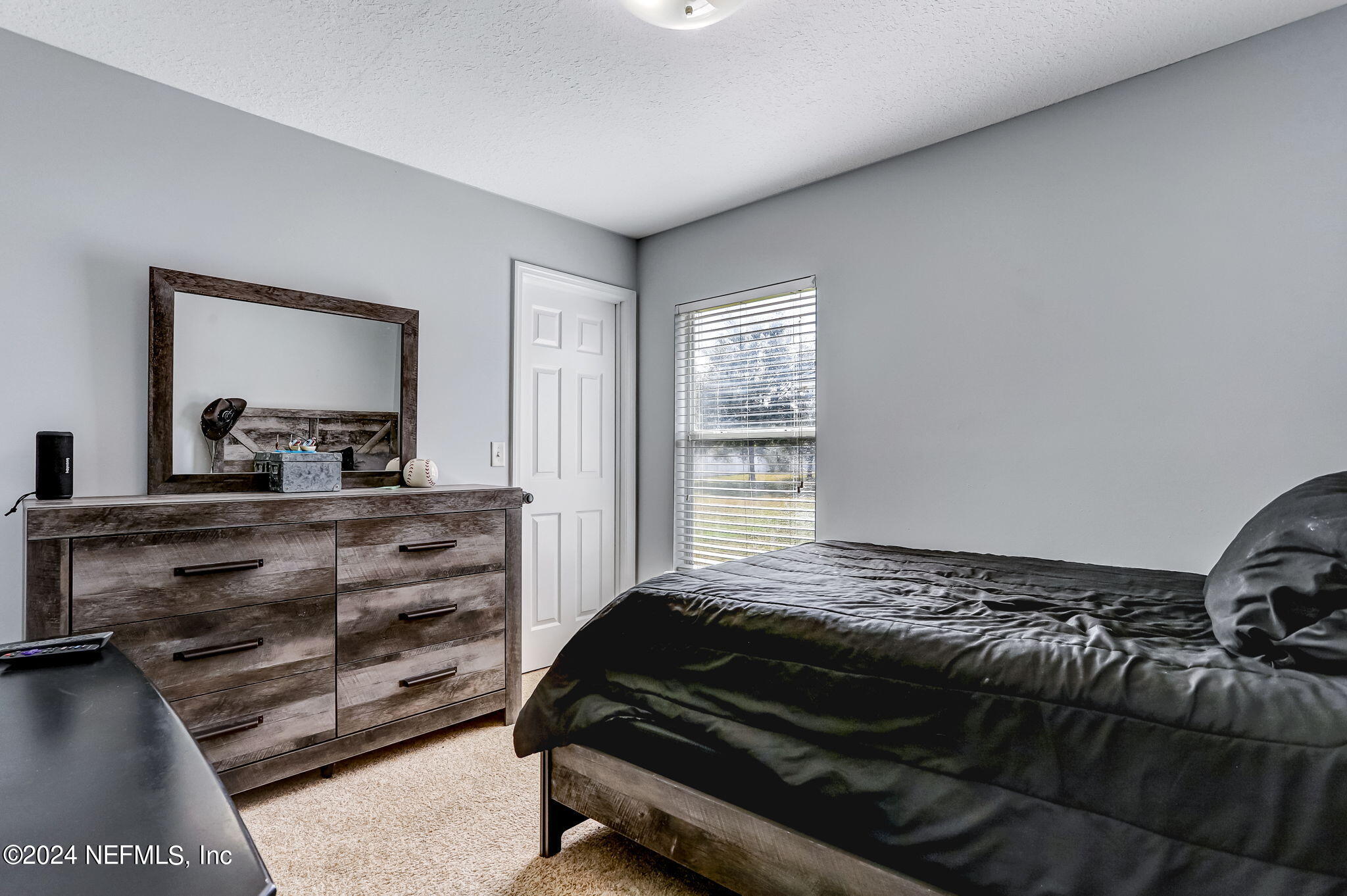 261 Porta Rosa Circle St. Augustine, FL 32092 - Photo 35 of 81 a bedroom with a bed and a dresser