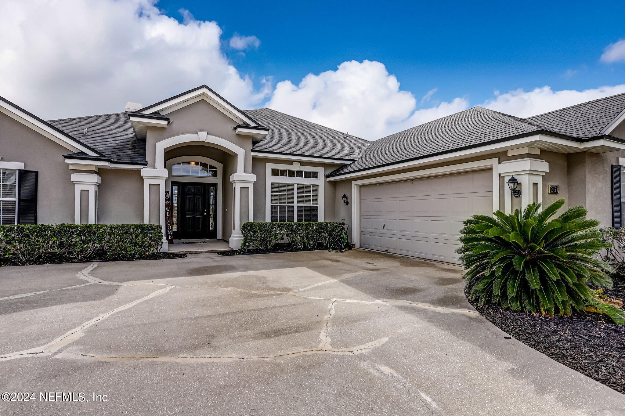 261 Porta Rosa Circle St. Augustine, FL 32092 - Photo 4 of 81 a front view of a house with plants