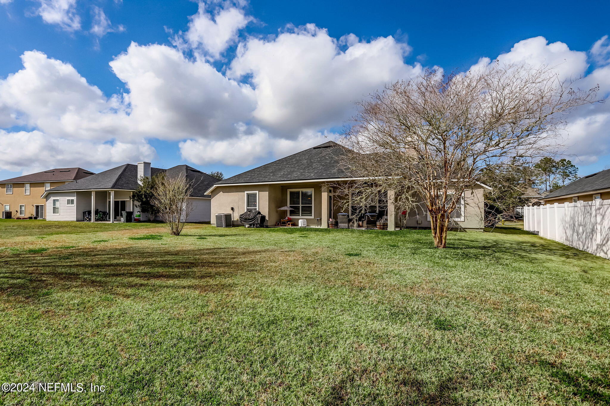 261 Porta Rosa Circle St. Augustine, FL 32092 - Photo 42 of 81 a front view of a house with a garden