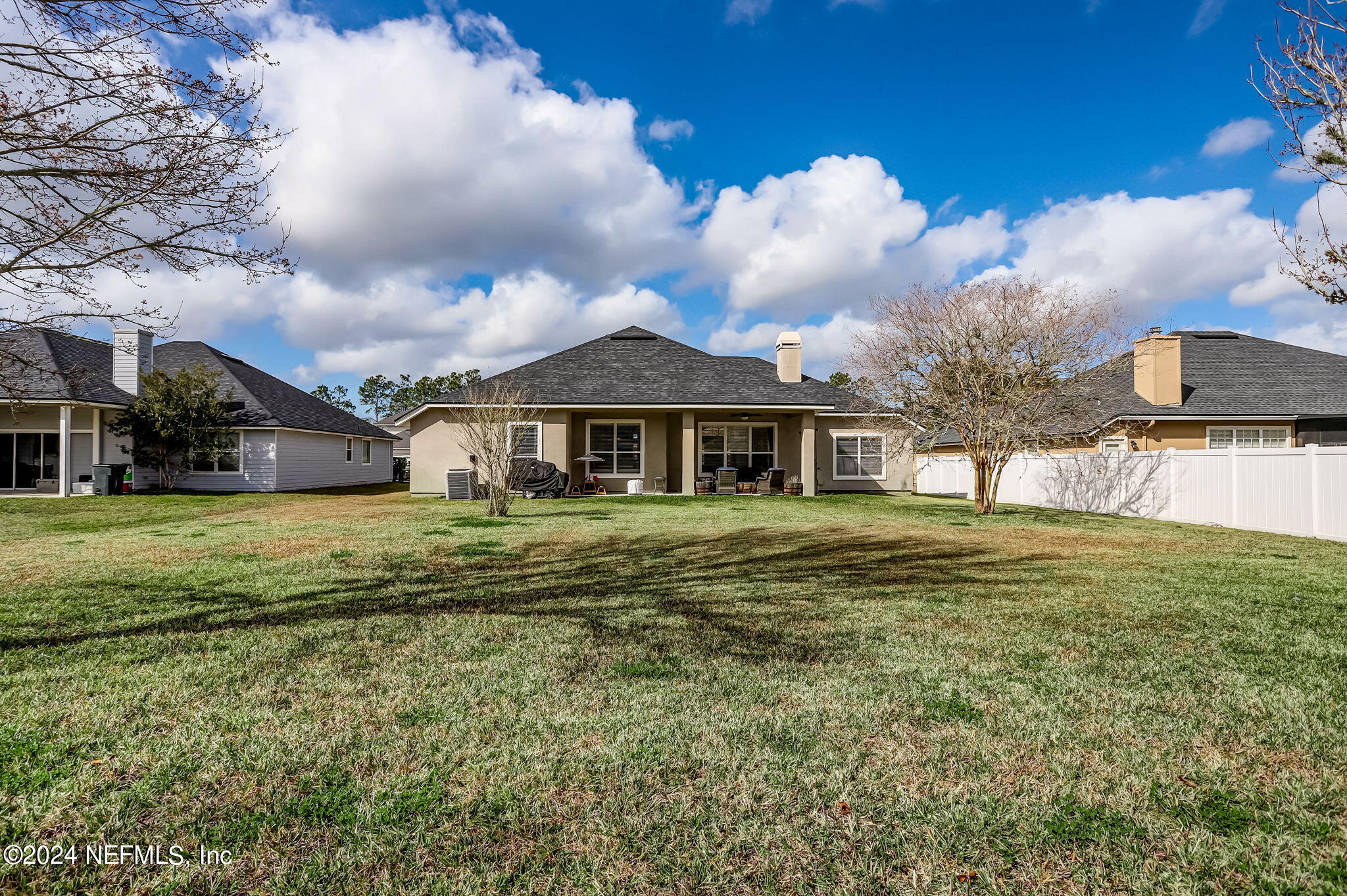 261 Porta Rosa Circle St. Augustine, FL 32092 - Photo 43 of 81 a front view of a house with a garden