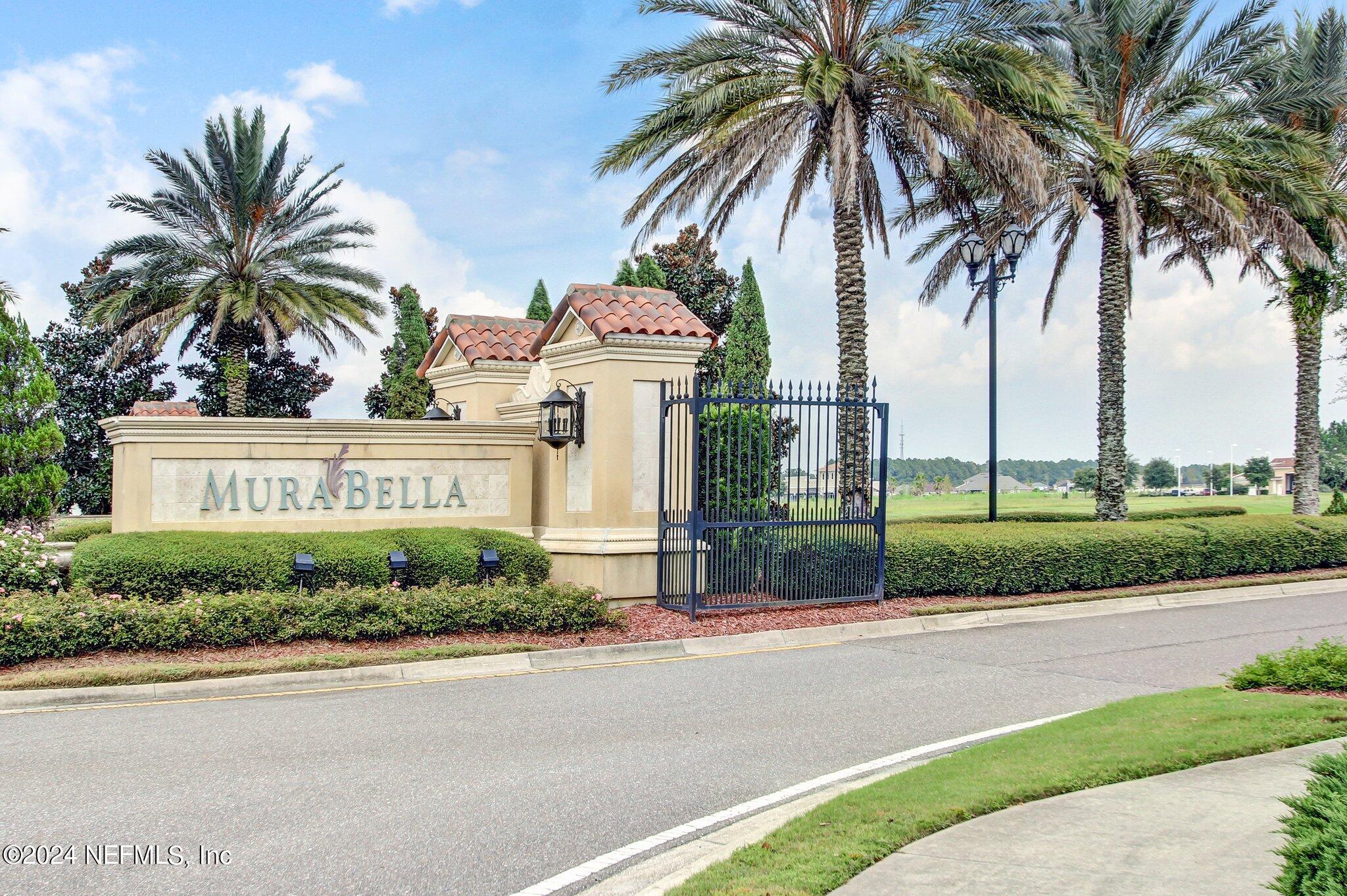 261 Porta Rosa Circle St. Augustine, FL 32092 - Photo 49 of 81 front view of house with a yard and palm trees