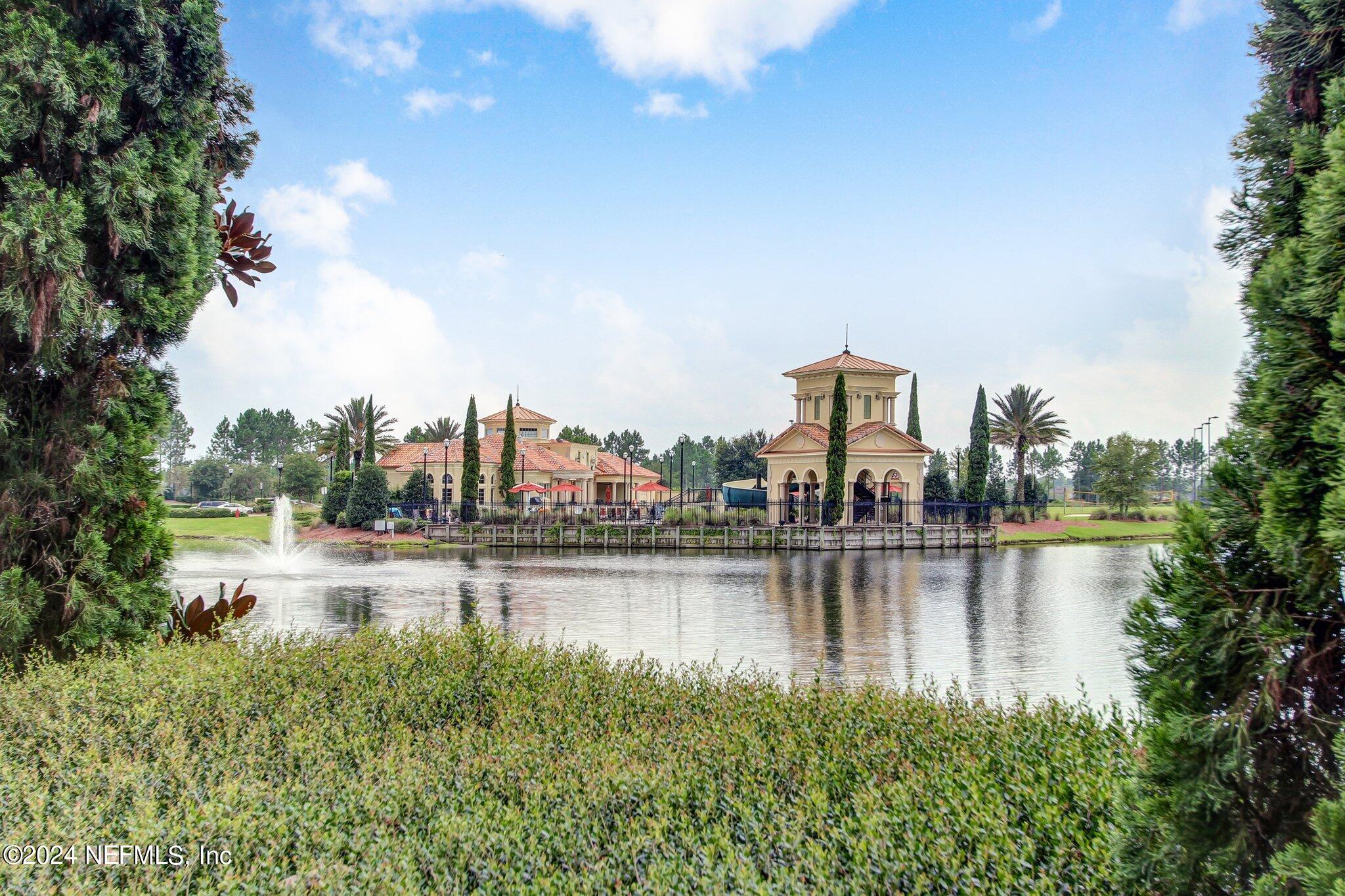 261 Porta Rosa Circle St. Augustine, FL 32092 - Photo 50 of 81 a view of a lake with houses in the back