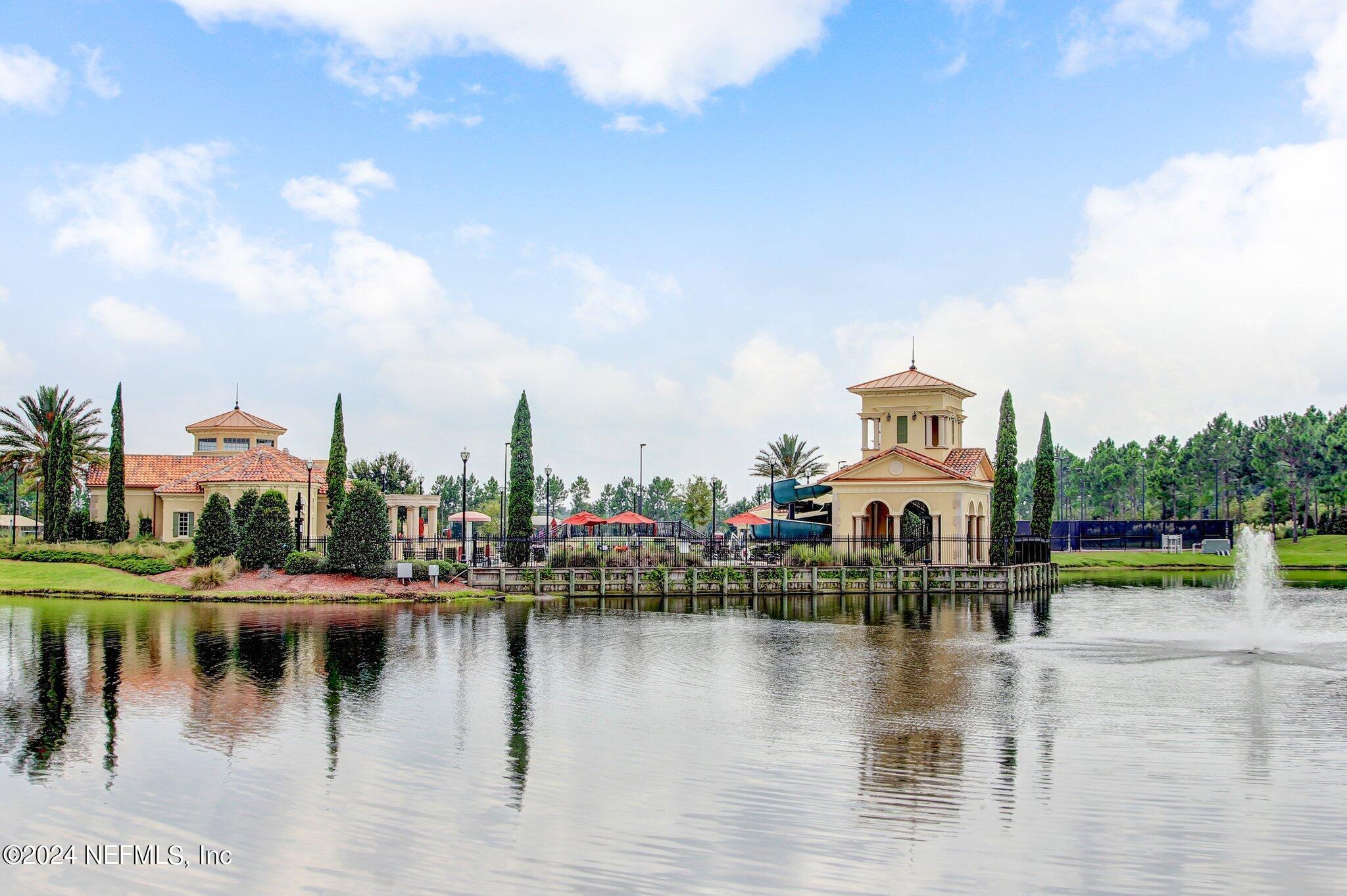 261 Porta Rosa Circle St. Augustine, FL 32092 - Photo 56 of 81 a view of a lake with a house