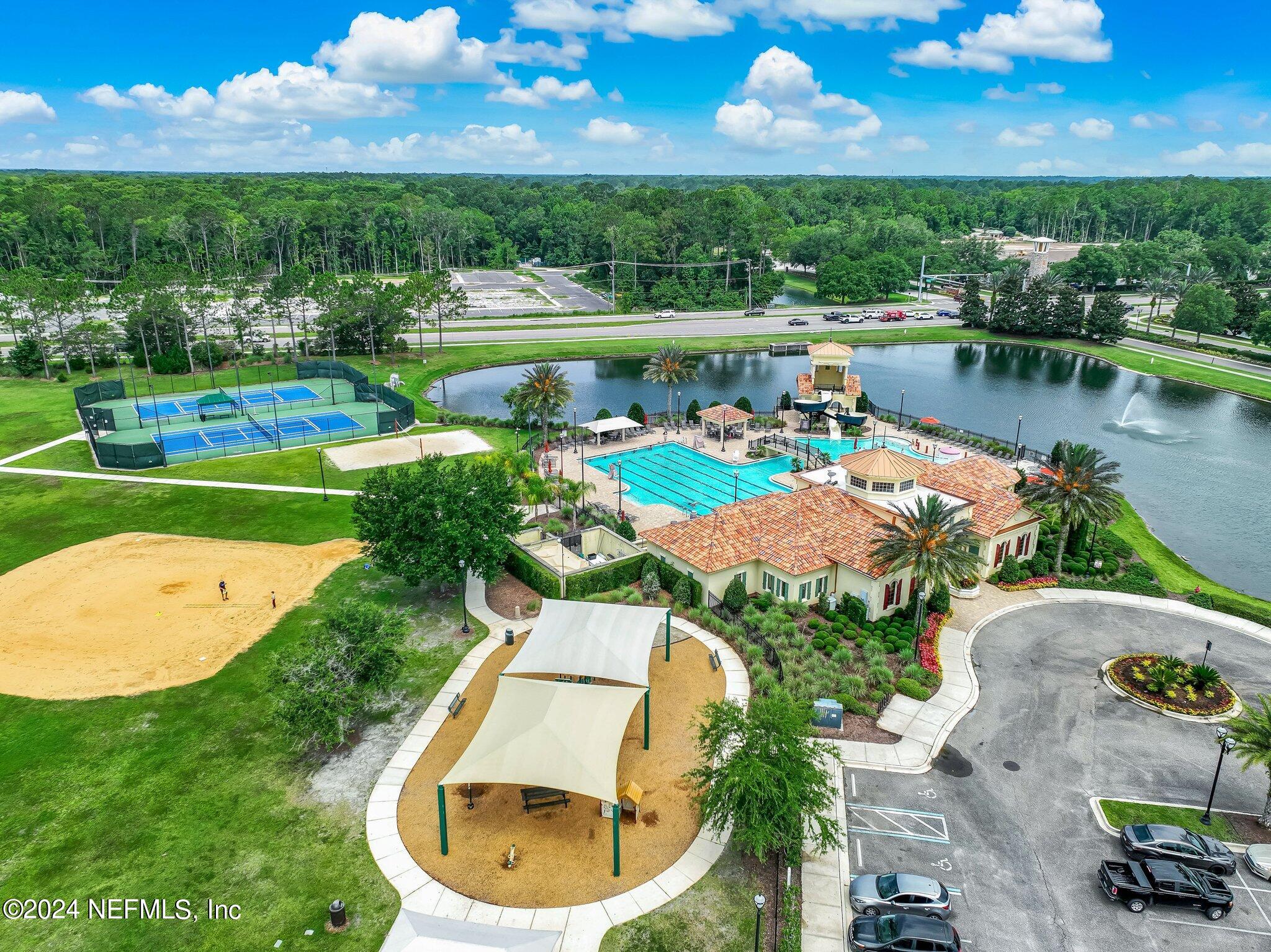 261 Porta Rosa Circle St. Augustine, FL 32092 - Photo 58 of 81 an aerial view of a house with a garden and lake view