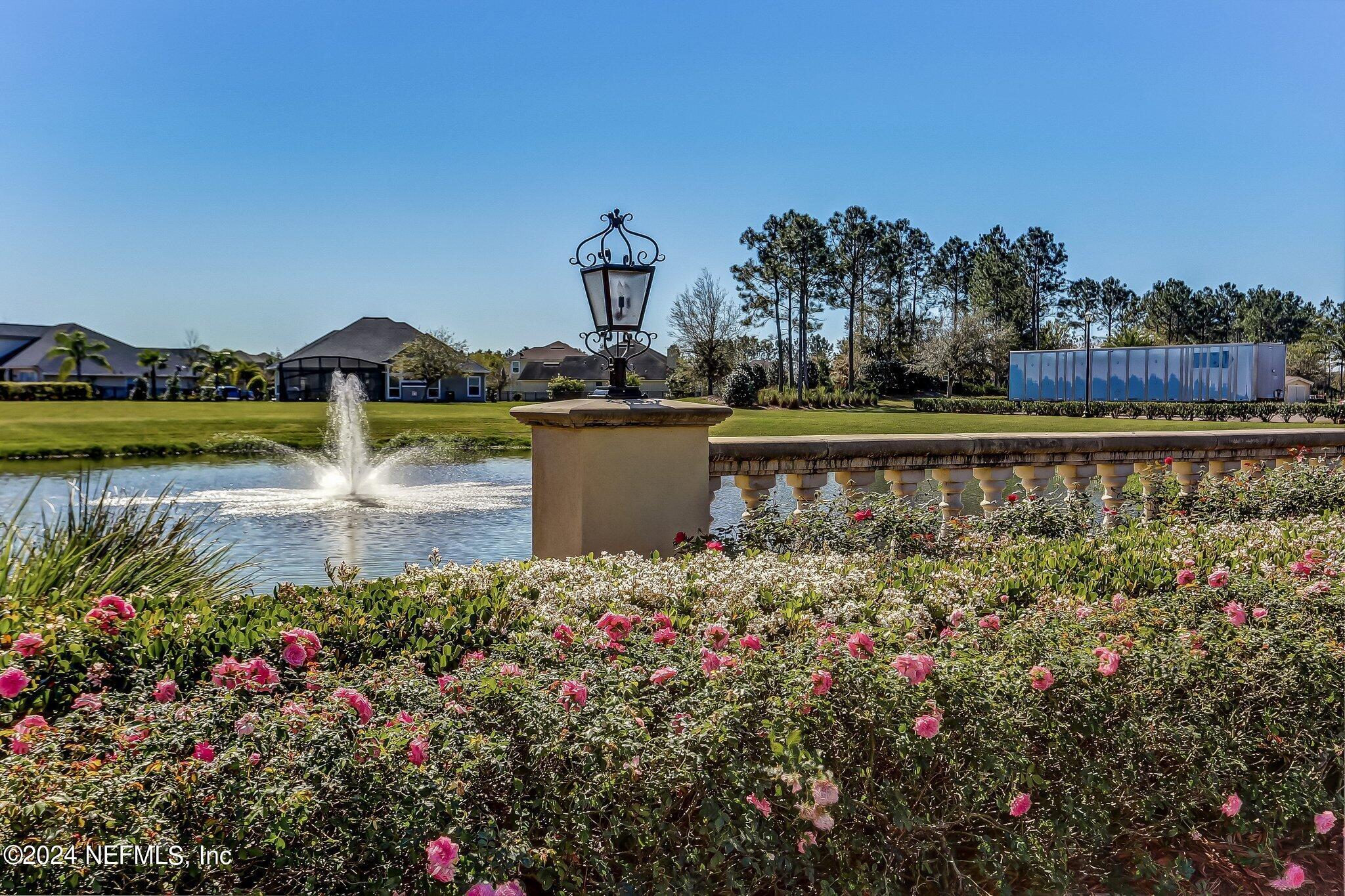 261 Porta Rosa Circle St. Augustine, FL 32092 - Photo 80 of 81 a view of a lake with a house in the background